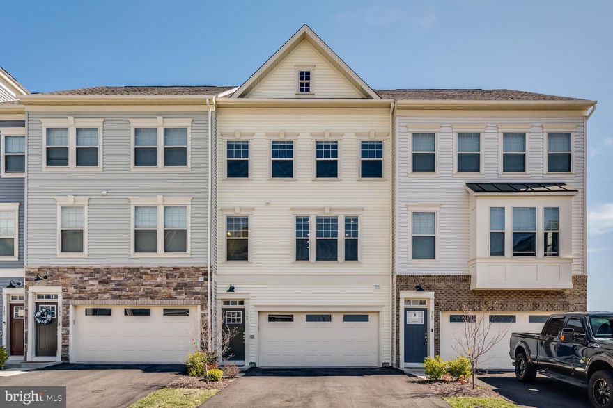 Assumable VA loan with 3.625% rate! This like new townhome is conveniently located just a couple minutes from I-95, commuter lots, Quantico, shopping, and only 8 miles from VRE. This unique home was built in 2022 and shows like new! This is the ONLY home in the neighborhood with the optional 4th level which includes a private terrace offering absolutely stunning sunrise views. 4 spacious bedrooms with the opportunity to convert the basement to an additional bedroom. Basement offers entry from the oversized two car garage and sliding glass doors to your backyard which can be fenced. Beautiful gourmet kitchen with a large island that is the anchor for entertaining space on this open concept main level. Third level features 3 bedrooms, a spacious primary bedroom with ensuite bath and walk-in closet. This stunning home is a commuter's dream that is not to be missed! Fiber optic high speed internet included with HOA fee!