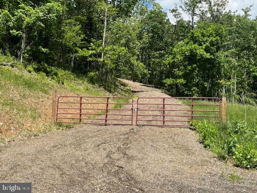 LOOKING FOR A PLACE OF YOUR OWN?  YOU'LL FIND IT ON THE 20.34 ACRES WITH AN EXCAVATED ROAD, WHICH LEADS UPWARD TO A CLEARED BUILDING SITE, WITH VIEWS OF THE MOUNTAINS!  LOCATED IN THE BLUFFS ON THE POTOMAC RIVER. THERE'S A PRIVATEL, GATED ACCESSSECTION SET-ASIDE WITH DIRECT ACCESS TO THE SOUTH BRANCH RIVER FOR BOATING, SWIMMING AND PICNICING FOR THE LANDOWNERS TO ENJOY. HUNTING IS ALLOWED.   NOT READY TO BUILD?   PARK YOUR CAMPER OR PITCH A TENT ON YOUR SECLUDED LOT.  IT'S A SHORT DISTANCE TO KAYAK, FISH, OR PICNIC ALONG THE SOUTH BRANCH OF THE POTOMAC, WHICH IS EXCLUSIVELY SET ASIDE FOR THE PROPERTY OWNERS.  ATV'S ARE ALLOWED & EXLPORE THE MILES OF THE SUBDIVISION ROADWAYS. THE BLUFFS OF THE SOUTH BRANCH OF THE POTOMAC RIVER IS A GREAT PLACE TO UNWIND, RELAX AND ENJOY THE BEAUTIFUL WV MOUNTAINS.  IT'S AN EASY 2-2.5 HOUR DRIVE FROM THE DC / METRO AREAS.