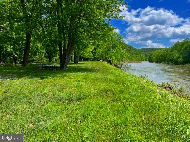 NOW'S THE PERFECT TIME OF YEAR TO GET YOUR RECREATIONAL OR BUILD YOUR FULL-TIME HOMESTEAD ON THIS LOT IN THE BLUFFS ON THE POTOMAC! BRING YOUR KAYAK, FISHING GEAR, ATV'S ALLOWED... JUST A GREAT PLACE TO OWN A 20 ACRE LOT. PRIVATE AREA FOR FLOATING & SWIMMING AREA WITH EXCLUSIVE ACCESS FOR THE LAND OWNERS IN THE BLUFFS. RIDE YOUR ATV'S OVER MILES WITHIN THE BLUFFS. BUILD YOUR CUSTOM CABIN ON THE PRIVATE BUILDING SITE ON THE NEWLY EXCAVATED BUILDING SITE $25,000. THE GRAVEL DRIVEWAY HAS A LOCKED GATE WHICH LEADS TO THE ENTRANCE UP TO THE CLEARED BUILDING SITE. CAMPERS ARE ALLOWED! SCENIC VIEWS FROM THE PRIVATE BUILDING SITE, WITH EXCELLENT ACCESS. JUST OUTSIDE OF THE POPULAR ROMNEY AREA. AND, IT'S A SHORT RIDE TO THE SOUTH BRANCH RIVER. NEARBY YOU CAN ENJOY A RIDE ON THE EXTERSION TRAIN, THROUGH THE MOUNTAINS AND ALONG THE SCENIC SOUTH BRANCH OF THE POTOMAC.