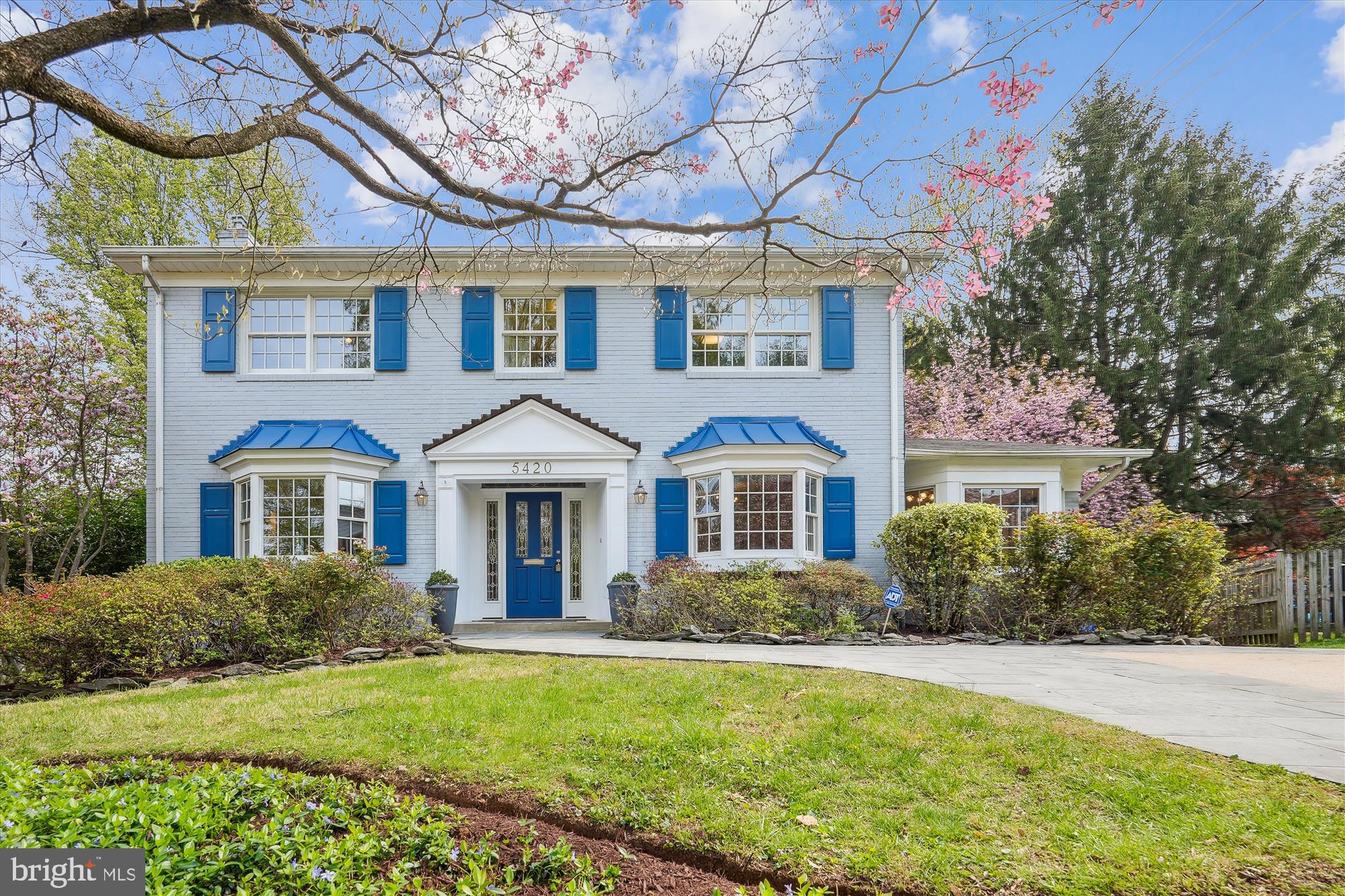 Don't miss this unbeatable home at the end of a quiet cul-de-sac in Maplewood/Alta Vista—this impressive 5-bedroom, 4-bathroom colonial blends classic charm with modern comfort in one of Bethesda’s most convenient and desirable locations.
A pair of beautiful, clear leaded glass windows welcomes you at the front door, setting the tone for the thoughtful details throughout the home. Inside, spacious, light-filled living areas with hardwood floors and timeless architectural touches offer both comfort and character. The main level features a combined living and family room anchored by a cozy fireplace, along with two additional rooms perfect for bedrooms, offices, or flex space.
Just off the main living area, a stunning sunroom/office offers a serene escape with vaulted ceilings and two walls of large windows that bring in abundant natural light. Whether you're working from home or relaxing with a book, this space offers peace, privacy, and a strong connection to the outdoors.
The kitchen is bright, functional, and well-equipped, featuring stainless steel appliances, generous cabinet space, and a sunny breakfast nook framed by a bay window that overlooks the private backyard. Just off the kitchen, a screened porch with vaulted beam ceilings creates a perfect retreat—ideal for morning coffee or quiet evenings, rain or shine. Step further out onto the large rear deck, designed for effortless outdoor entertaining and weekend barbecues. Upstairs, you'll find four large bedrooms with plenty of closet space and natural light.
The fully finished, daylight walkout lower level further expands the living space. It features a spacious recreation room with high ceilings, a wall of built-in cabinets, and plenty of room to relax or entertain. This level also includes a bedroom and full bathroom, plus two separate storage rooms to help keep everything organized. The walkout leads to a beautifully landscaped backyard with room to entertain, garden, or enjoy a quiet afternoon outdoors.
Located just one block from Maplewood/Alta Vista Local Park and minutes from two Metro stations and downtown Bethesda, this home offers the perfect blend of space, setting, and convenience.