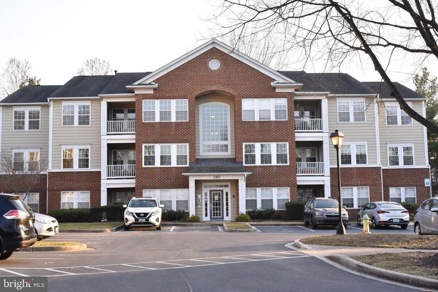 Welcome to your new home at 2402 Dominion Dr #3B! This sunny, beautifully maintained condo seamlessly blends comfort and convenience. This 2-bedroom, 2-full-bath unit features cathedral ceilings a fireplace , new carpet and a fresh coat of paint . Step into a bright, spacious open floor plan that connects a large living area with an elegant dining space—ideal for entertaining. The bright open kitchen makes meal prep a breeze. Enjoy serene outdoor views from your private balcony, perfect for morning coffee or evening relaxation. The generously sized bedrooms offer plenty of natural light and closet space, creating a soothing retreat. Additional features include in-unit laundry and an assigned parking space for your convenience. Situated in the desirable neighborhood of Whittier, you're just a few steps from shopping and dining. The neighborhood boasts 3 pools, tennis courts, basketball courts, walking paths, a lake, and numerous tot lots. The convenient location is also close to historic Frederick and major commuter routes.