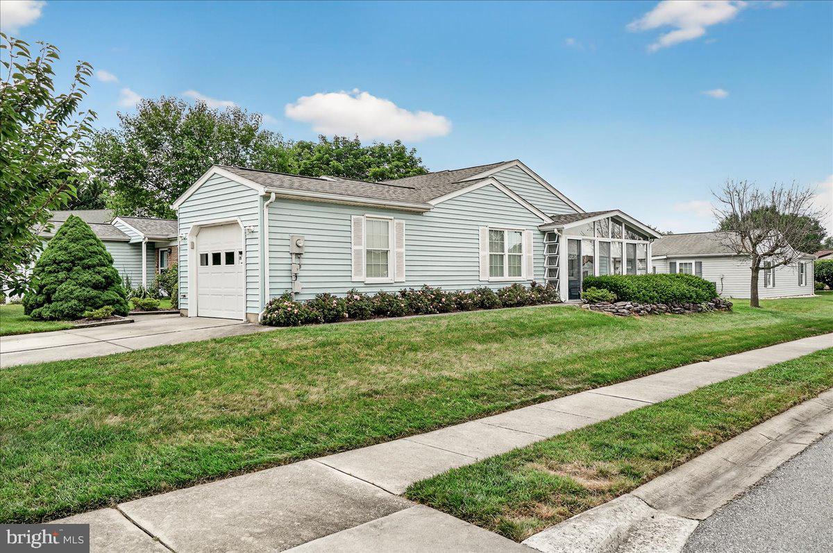 Proud to announce another great listing in Crestwood Village, a 55+ active adult community. This well-cared for Chesapeake model home has 2 bedrooms, 2 bathrooms, a separate laundry room and a sun-room with 4 sliding glass doors to let in the breeze! The owner kept it in immaculate condition and replaced the roof and HVAC in 2014 and windows in 2011. Lovely wood floors, some new lighting and just freshly painted, giving you a clean blank slate to make it your own. The community offers a club house, exercise room, library, banquet room, game rooms, billiards, swimming pool, mini golf/putting area, tennis & pickle ball courts, horseshoes, shuffleboard and so much more. The community also provides snow removal, gutter cleaning and lawn care service. All of this with no City taxes and easy access to shopping, dining, entertainment, Downtown Frederick and several major commuter routes. Don't miss out on the opportunity to call this fantastic home your very own!