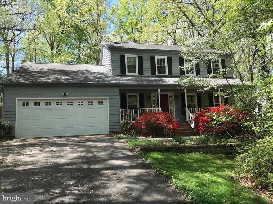 Beautiful, well maintained, one-owner home in amenity filled Aquia Harbour situated on a level lot.  4 bd, 2.5 bath Colonial with formal living and dining rooms. This home features 3 separate living spaces in which you can spread out with a formal living room, family room and large sunroom.  Family room features a wood stove off the kitchen with French doors leading out to back deck.  Enjoy your mornings sitting in the sunroom with floor to ceiling windows overlooking the backyard which backs up to the 3rd hole on the Aquia Harbour golf course. Sunroom also has a gas fireplace for those chilly days, newly finished hardwood floors and fresh paint.  Updated kitchen with granite counters and stainless-steel appliances. Updated bathrooms. New dishwasher, new front door, all new windows upstairs as well as in the kitchen, living room and downstairs bath.  All three bathrooms have ceramic tiled floors. Hardwood floors on most of the main level, new carpet upstairs. Crawl space has been insulated and a dehumidifier installed. Enjoy all the amenities Aquia Harbour has to offer such as a golf course, tot lots, tennis, basketball, marina, horse stables, 2 community pools, restaurant, a preschool, soccer fields, baseballs fields, biking and walking trails, picnic areas, fishing, restaurant, guard gate, police force. Close to shopping, I-95, Quantico and the VRE.