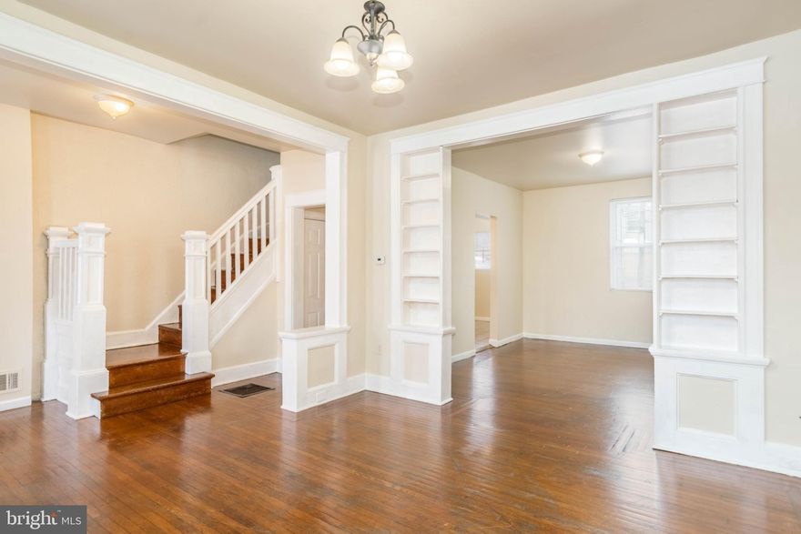 TURN KEY PORCH FRONT ROWHOME WITH OVER 1,300 SQ. FT. OF LIVING SPACE!  Features include gleaming hardwood floors throughout, a main level with a spacious living room with built-in bookcases, separate dining room, and galley kitchen.  The upper level offers 3 bedrooms and 1 full bath and the unfinished basement is perfect for storage.  Perfect opportunity for an investor looking to add to their rental portfolio or even a homebuyer looking for an affordable move-in ready home!