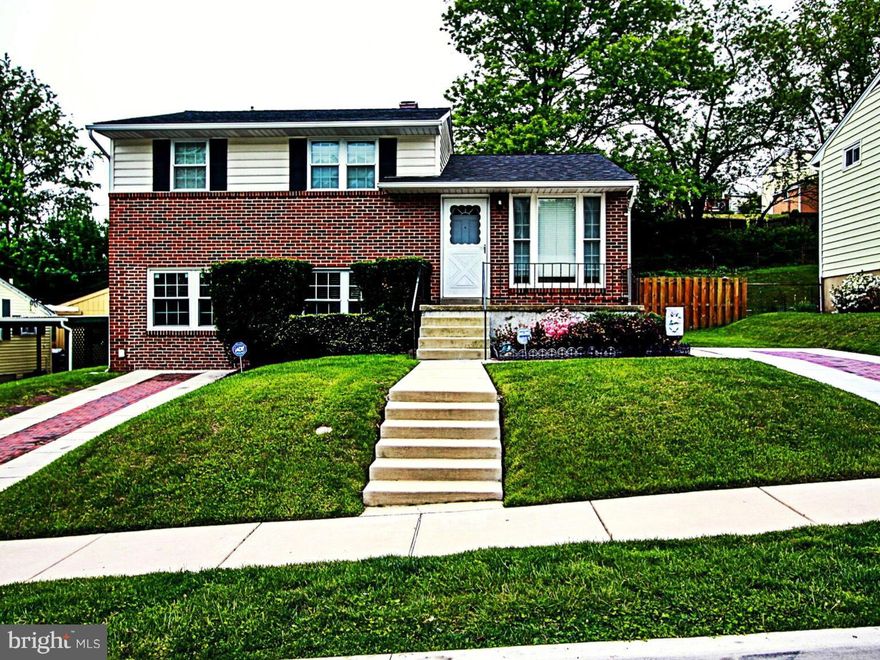 Beautifully maintained & updated split level in Carney. 3BR, 2 Bath. Fully finished club basement with elegantly tiled flr & finishes complete with built- in ceiling speakers & surround sound ready. Hardwood flooring throughout first & second lvls. Granite counter top kitchen w/SS appliances. New roof. New 16x16 trex deck with stair lighting. Fully fenced in back yard, 2 driveways w/ brick inlay.