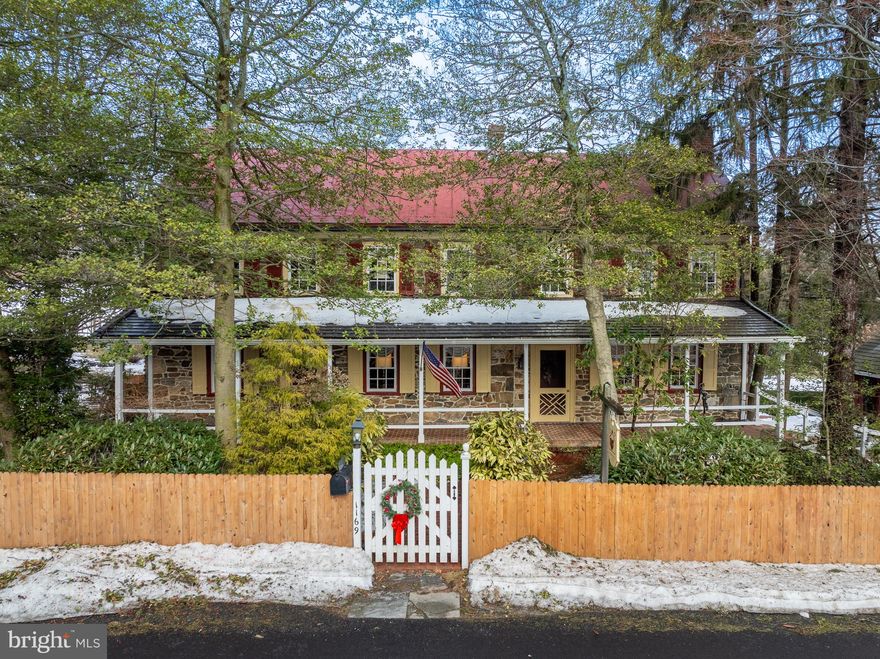 Colonial charm meets timeless character in Chester Springs! Located at 1169 Saint Matthews Road in West Vincent Township, this one-of-a-kind historic home dates back to the 18th century and beautifully blends its original architecture with thoughtful additions completed in 1980 and the 2010. Set on 7.4 acres, the 3,614 square foot  home features a front sitting patio and a large enclosed brick patio overlooking the backyard and pastures—perfect for entertaining and tranquility. The home offers 3 bedrooms, 3 full baths, and 2 half baths, with both levels showcasing distinctive architectural character enhanced by hardwood and tile flooring throughout. A bright sunroom with floor-to-ceiling windows/sliding doors and a classic brick floor overlooks picturesque scenery. A spiral staircase leads to a loft featuring a striking floor-to-ceiling built-in bookcase. All three bedrooms include ensuite bathrooms—the loft offers a half bath, while the remaining two feature full baths. A third full bath is on the main level off the living room, complete with a standing shower and separate bathtub with a tub rail. The home also includes convenient laundry on both the main level and in the basement.

Equestrian enthusiasts will appreciate the impressive outdoor amenities, including a large bank barn, built with local stone that features 10 stalls, a tack room, a blanket room, a tool room, a half bath, and extensive upper-level storage for feed, farm equipment or carriages. The barn opens directly into one of two pastures, which together feature four run-in sheds and a feeding trough. The property also includes the original one-car garage as well as a newer oversized three-car garage, along with two separate driveways—one serving the home and one the barn. This exceptional property offers timeless character, functional space, and a rare opportunity to own a piece of history.