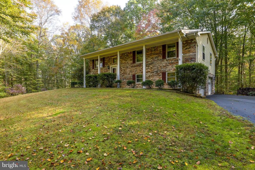 Your private retreat awaits on this almost 3 acre cul-de-sac lot featuring mature trees. Open kitchen features corian counters, ceramic tile flooring, gas cooking + lots of light. Large living & dining rooms provide ample space for entertaining. 3 bedrooms, 3 full baths. Finished lower level has large rec room with fireplace. Large deck and screened porch for outdoor living. New roof in 2016.