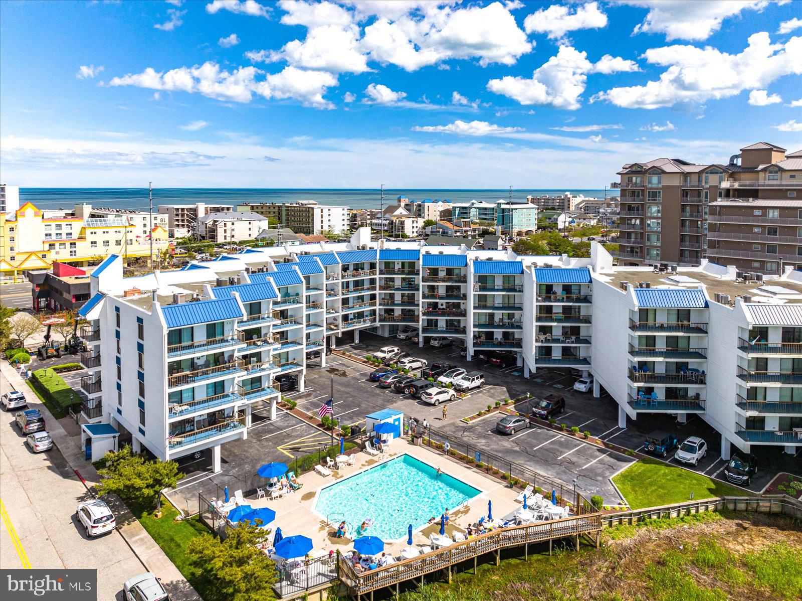MAJOR PRICE REDUCTION! BEAUTIFULLY APPOINTED 2 BEDROOM, 2 BATH BAY SIDE CONDO W/STUNNING SUNSET VIEWS! UNIT HAS GENERATED OVER $20,000 IN RENTAL INCOME! WITH A POTENTIAL OF MUCH MORE! Tiled Interior Throughout Makes Clean Up A Breeze After A Day At The Beach. NEW Furnishings, Lighting, Sliders, HVAC & Appliances Gives Luxury To Coastal Living! Full Size Washer/Dryer Makes Washing Beach Towels A Breeze! In Ground Outdoor Pool Is Heated & Stays Open Late For An Evening Swim !
Enjoy Nightly Sunsets While Your Preparing Dinner or Sitting On The Spacious Balcony Taking In The Warm Summer Breeze. Building Has Been Meticulously Maintained Boasting A New Roof, Exterior Paint & Caulking! The Perfect Mid Town Location Allows Walking To Restaurants, Shopping & Nightly Entertainment. Just A Short Stroll For A Day At The Beach & Then Unwind At The Bayfront Pool. Reserve Study Has Been Completed. Easy To Show! Assessment will be paid by July 2025 for building updates.