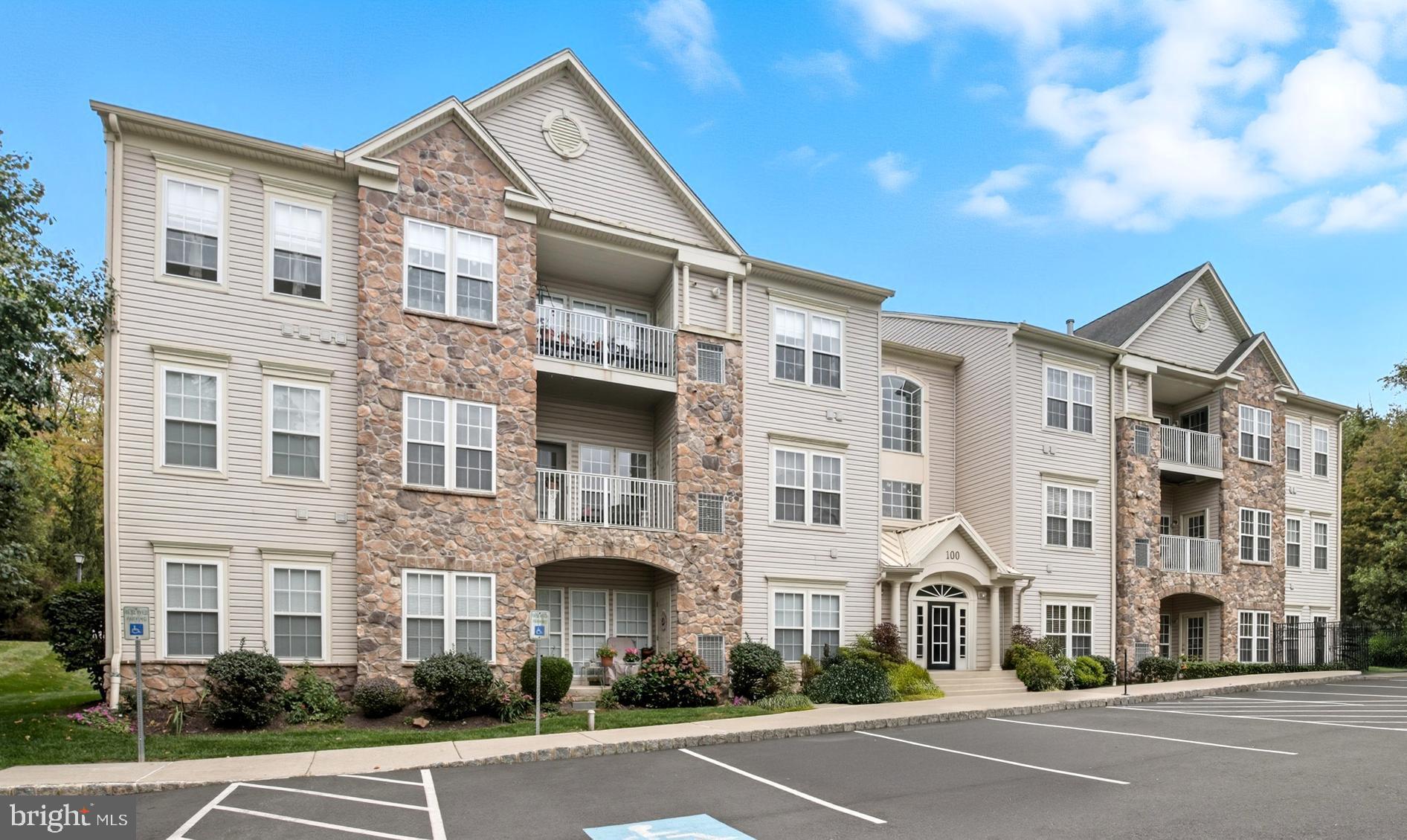 Welcome to Forest Ridge, an exclusive 55+ community where the active adult lifestyle is enhanced by modern amenities and low-maintenance living. This upgraded 3rd floor, 2-bedroom, 2-bathroom unit with a spacious loft is the largest floorplan (1,837 sq/ft) in the development and is move-in ready! A foyer entry with double closets leads to an impressive living room complimented by a cathedral ceiling, gas fireplace, and an abundance of natural light from a wall of windows. Hand scraped engineering wood floors extend from the living room into the dining area enhanced by double windows, mirrored wall and a French exterior door that leads to a private balcony. This side of the building gets great sunlight, adding to the enjoyment of this outdoor space. A centrally located kitchen features a breakfast bar adorned with custom trim work and stylish transom, Corian countertops, stainless steel appliances--including gas range, large pantry & access to the convenient in-unit laundry area. All appliances and widow treatments are included in the sale. Shadowbox moldings complement the staircase up to a large loft space with upgraded vinyl plank flooring. This area is the perfect for a guest room, den or office. Retreat to the primary suite, featuring a vaulted ceiling, walk-in closets and a private full bathroom with tile flooring, double vanity, linen closet and stall shower. An additional well-appointed bathroom is conveniently accessible from both the secondary bedroom and living room area. Ceiling fans are installed in nearly every room and both bathrooms feature comfort-height toilets. Don't miss the updated utilities—the HVAC system (2020) and hot water heater (2019). Common area/grounds maintenance, landscaping, snow removal, and trash removal are included in the monthly association fee. The community clubhouse is a hub of activity with a meeting room and event space, fostering an active and social lifestyle for residents. Pets are welcome. Shopping, dining, nightlife and community events are just minutes away on route 611 in Warrington and in historic Doylestown Borough. Book your private showing today!