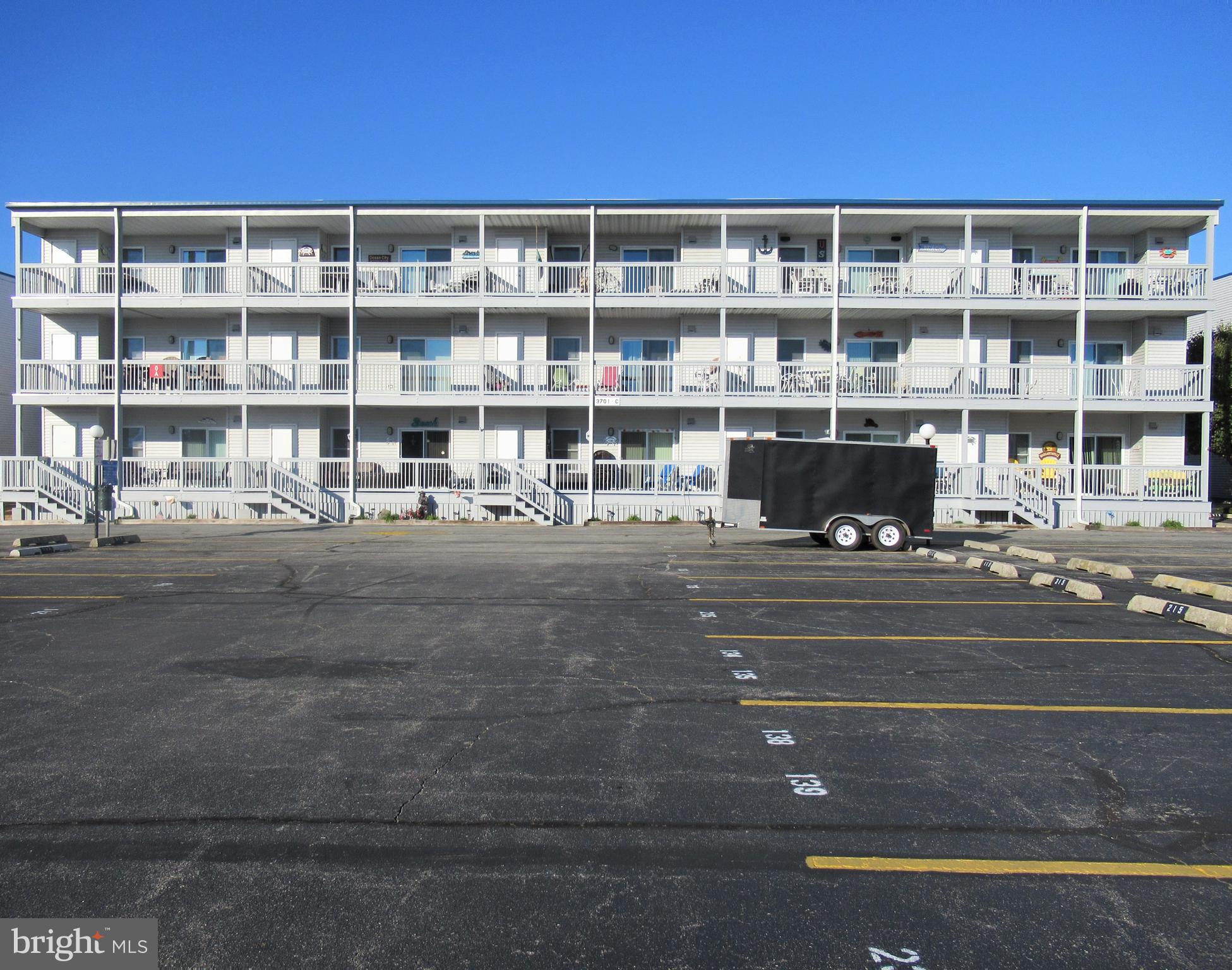 This well maintained 2BR/BA bayside condo in Ocean City Maryland is located just 2 blocks south of the convention center and is within steps from the beach & busline and less than a mile away from Ocean City's famous oceanfront boardwalk. The unit is just 3 years old and features a porch offering beautiful views of the bay along with a storage closet for beach gear, an open floorplan, a large breakfast bar, a master bath, drywall interior, a sprinkler system, a laundry room with a full size washer & dryer and a fully equipped kitchen that includes a refrigerator with an ice-maker, a smooth-top self-cleaning oven, a dishwasher, a built-in microwave oven and a garbage disposal. The complex features an abundance of off-street parking, with 2 assigned parking spaces per unit, an outdoor swimming pool that overlooks the bay, boat slips, a boat ramp and a small private bayfront beach.