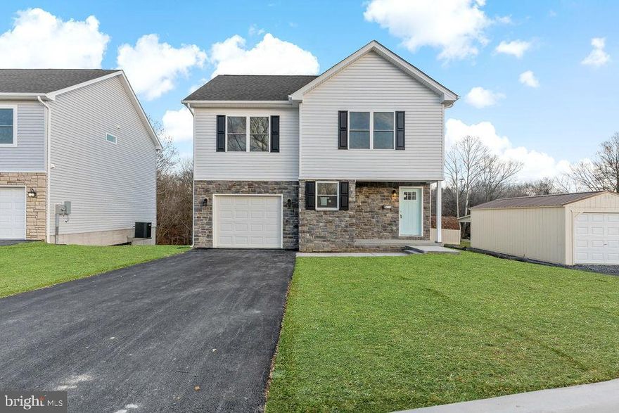 Immediate Delivery, 2 additional homes less than 30 day delivery! Make brand new home ownership a reality! Tucked away on the edge of town, with NO HOA you'll find this gem! 3 bed, 2.5 bath new construction home with full walkout basement backing trees and attached garage. Home is finished with luxury vinyl plank flooring on main level, stainless steel appliances, upgraded countertops, and upstairs laundry. The primary suite features a walk in closet, double bowl sinks, and tiled shower. Public water and sewer, paved road, driveway, and sidewalk. Secure this home as yours today! *Disclaimer: Lawn digitally enhanced*