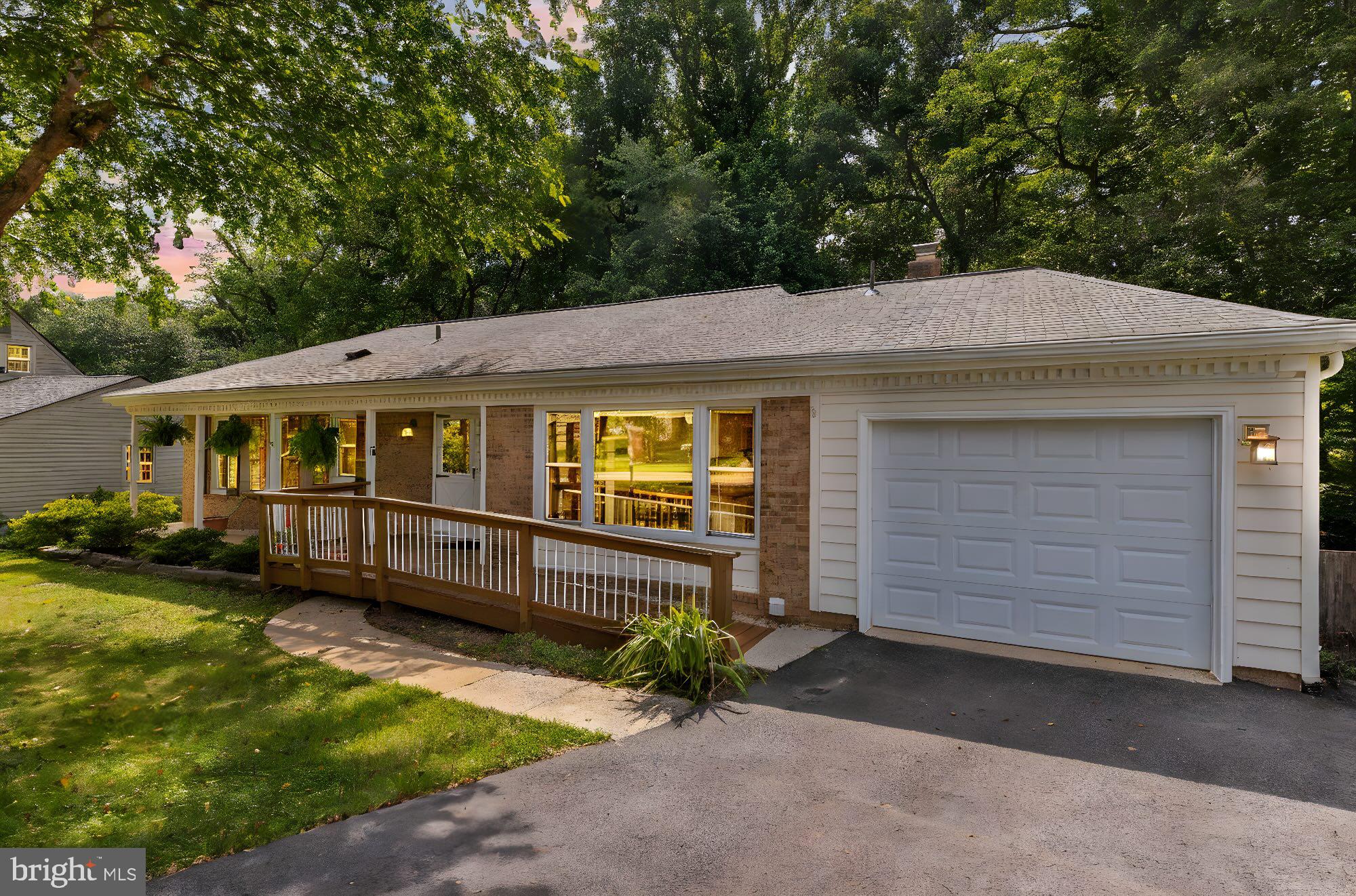 Nestled in the sought-after Saratoga neighborhood, this beautifully maintained five-bedroom, three-bath rancher offers flexible and functional living across two thoughtfully designed levels. The walkout lower level features a cozy rec room with a wood-burning fireplace, a second kitchen, and a second laundry room—ideal for guest quarters, or effortless entertaining. Sliding glass doors open to a fully fenced backyard that backs to trees, creating a private outdoor retreat perfect for barbecues or relaxing in nature. Upstairs, the main level boasts warm wood and carpeted floors, an updated bathroom, and a charming screened porch that invites year-round enjoyment with serene views and no bugs. Close to local roads, highways, Saratoga Shopping Center, dining and much more! Combining comfort, versatility, and seamless indoor-outdoor flow, this home is a rare gem in Springfield—perfectly suited for modern living.