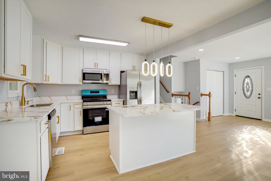 This fully renovated home combines modern comfort with stylish design across two spacious levels. On the main floor, you'll find an open-concept layout filled with natural light, connecting the living and dining areas to a sleek new kitchen outfitted with white cabinetry, quartz countertops, and stainless steel appliances. Three bedrooms and two updated bathrooms, including a well-appointed master suite, offer plenty of room for everyday living. Beautiful hardwood floors throughout enhance the inviting atmosphere. The lower level adds flexibility with one additional room, a full bathroom, and a spacious living area—ideal for entertaining, working from home, or simply relaxing.  With thoughtful updates and move-in-ready appeal, this home is ready to welcome its next chapter. Schedule your showing today!