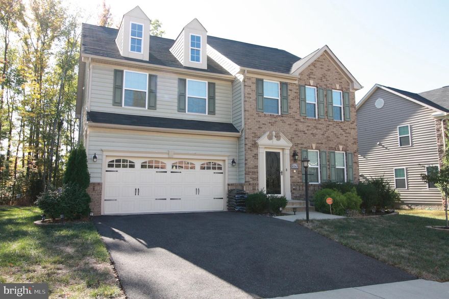 DONT WAIT UNTIL AFTER CHRISTMAS!!! Prices are going up!!!Beautiful 5-year-old 3940 sq ft home just waiting for you to move in! House boasts 4 bedrooms on the upper level with 5th bedroom in the fully finished basement. Entertain your friends in the spacious open floorplan. Large gourmet kitchen suitable for the chef and also has a breakfast bar for the quick snack and plenty of room the large kitchen table. The bedrooms on the upper level are all good size and the master has 2 walkIns. New carpet. House backs up to a forest conservation area so nothing will be built behind you. Close to schools, shopping churches, grocery stores. Easy commute to Joint Base Andrews or DC. Nice place to call HOME !. Don't miss this bargain..it will go quick! Homes in this neighborhood sell in just a few days !!