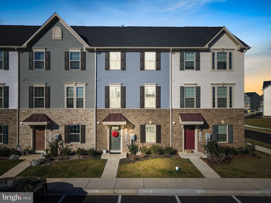 **Holiday Special - Price Reduced**No need to wait for new construction when you could be all snuggled in here to ring in the New Year! Welcome to this barely lived-in 2021 gorgeous 3 level town-home in the sought-after Hamptons West section of Lake Linganore. Nothing to do but move right in and start to enjoy your amazing gourmet kitchen, spacious living areas perfect for relaxing or gracious entertaining, and much more.  The first floor features a charming entry foyer with built-in coat cubby, half-bath, a bonus room/office with glass doors and an expansive recreation room with walk-out to level yard. The second floor offers the open floor plan that everyone wants with spacious formal living room; half-bath & center-isle kitchen with upgraded backsplash & stainless steel appliances, granite counters & an abundance of storage--as well as doors leading out to the deck.  Upstairs you'll find 3 cozy bedrooms with ample closet space and 2 full baths.  All of this can be yours along with the many wonderful amenities that the Lake Linganore life has to offer...including trails, beaches, swimming pools, community recreation areas & special events.  
You really can have it all!