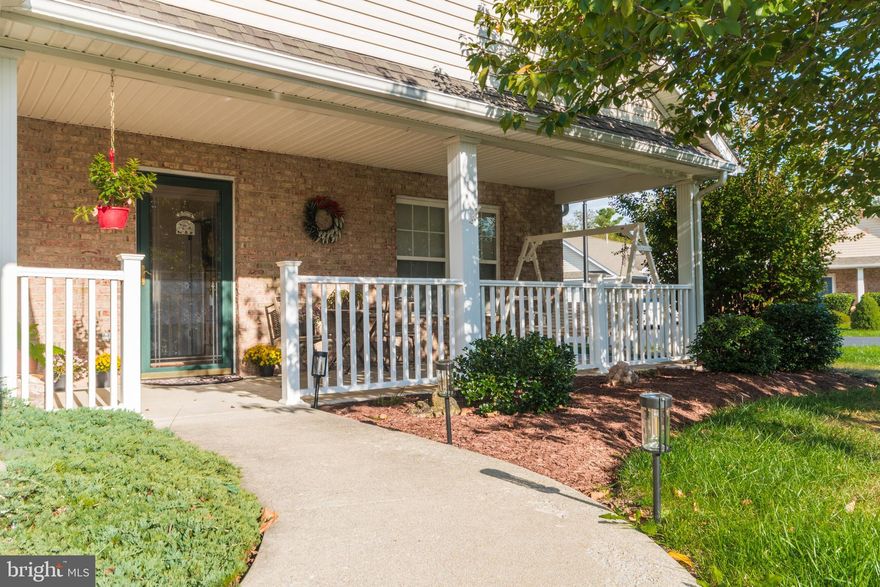 PRICE REDUCED OVER $10,000!!!  Charming well maintained corner lot unit in desirable Woodbrook Village 55 and over community. 2 bedroom, 2 bath home with spacious living/dining room...almost 1400 square feet. Nice sized kitchen with newer appliances, breakfast area and adjoining utility room/office nook and laundry. One car garage with plenty of storage space. Large covered front AND back porches, side and back yards. New roof this past spring. HOA covers all lawn maintenance and common areas, snow and trash removal and water and sewer fees. Located conveniently to shopping, restaurants, hospital and major highways, this is a must see property. Schedule your showing today!!