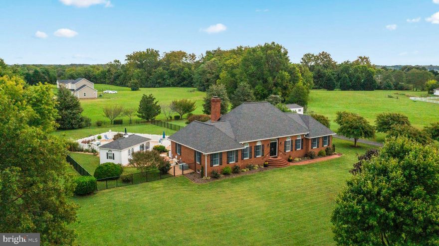 This stunning, meticulously maintained brick home is a true gem in a serene neighborhood.  The property is a dream come true, as a community boat ramp and pier are just one block away with deep water access to Nomini Creek and the Potomac River.   As you step inside the 3 bedroom, 2-bathroom home, you will immediately notice the gracious flow, perfect for hosting dinner parties and gatherings.  Cozy evenings by the gas logs in the family room await, creating a warm and inviting atmosphere.  The master suite, situated on its own wing, offers a walk-in closet and double bathroom vanity.  Step outside, and you'll find your own private oasis - a saltwater pool complete with a slide and fountain.  The pool house with a screened porch adds convenience and charm to this outdoor space.  An outside rear open porch awaits off of the family room -perfect for sipping morning coffee or unwinding in the evening breeze.  This home also offers a full, unfinished basement with built-in storage and plumbing rough-in, allowing you to customize to your liking.  The 2-car garage with oversized doors and a garage heater adds convenience and comfort, especially during the colder months.  Additional features include a whole house generator, new landscaping with river rock surrounding the pool area and freshly painted interiors.  Don't miss your chance to make this your dream home!!!