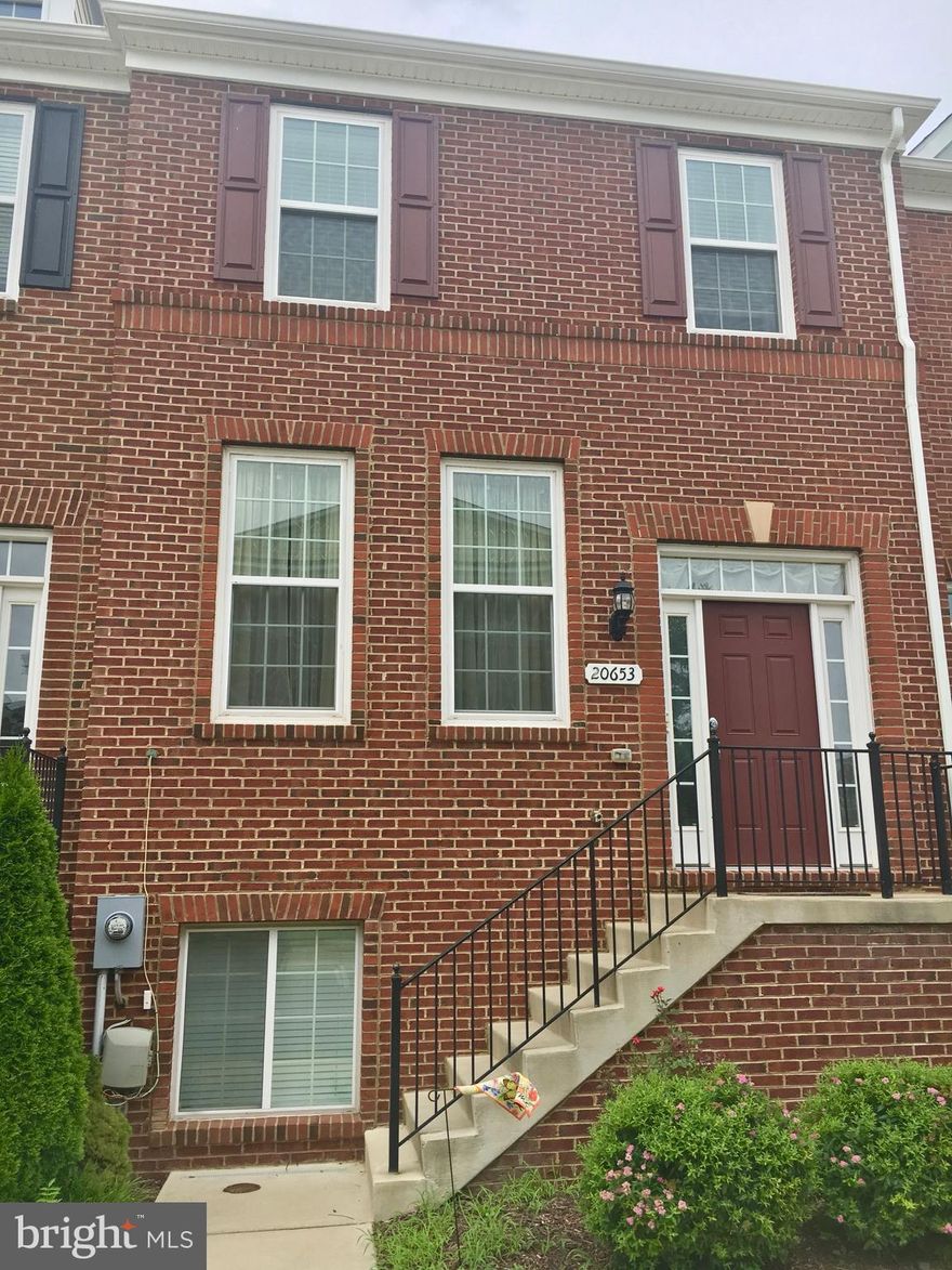 BEAUTIFUL Pulte Townhouse across the Park w/ Gazebo! Spacious home in Belmont Station ES/Trailside MS/Stone Bridge HS district. Gourmet kit w/ granite counters, 42" cabinets, island, HW floors, deck. Nice open floorplan w/ lots of windows and natural light. Rec room in the LL. 2 car gar. Walk to the pool, Harris Teeter, shops and restaurants & commuter lot to W. Falls Church Metro.