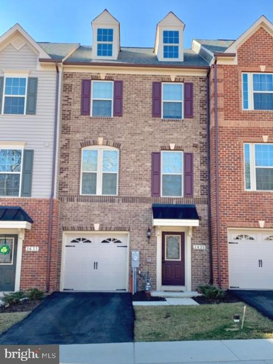 Gorgeous brick front townhouse w/1 car garage. Open concept floor plan w/hardwood floors & neutral decor. Gourmet kitchen with espresso cabinets, granite and stainless steel appliances. Huge main level living/dining/kitchen area with deck off kitchen. Lower level features 1/2 bath and a huge family room. Enjoy master bedroom oasis perfect for relaxing featuring attached bath w/soaking tub and separate shower. Laundy area, 2 additional bedrooms and a full bath complete the upper level.  Conveniently located near 95 & 295 shopping, restaurants & schools.