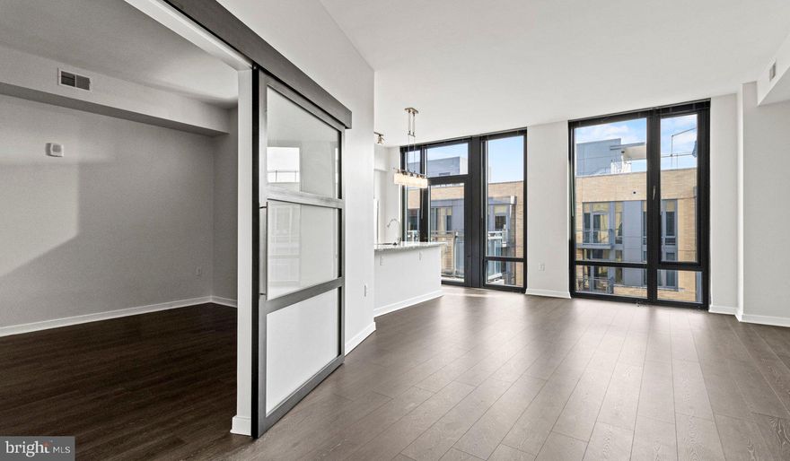 Nestled in the vibrant heart of Bethesda, Maryland, this luxury apartment complex offers an unparalleled living experience that combines modern convenience with sophisticated design. Designed to cater to the discerning tastes of urban dwellers, this property stands as a testament to luxury living, where every detail has been meticulously crafted to ensure the utmost in comfort and style.

*Exceptional Location*
Located in the sought-after Woodmont district, the apartment complex is perfectly positioned as a gateway to the best that Bethesda has to offer. Residents enjoy easy access to a plethora of amenities, including the Walter Reed National Military Medical Center, the NIH, and a variety of shopping, dining, and entertainment options. The prime location also offers convenient access to public transportation, making it easy to explore the wider metropolitan area.

*Architectural Elegance and Design*
The building's U-shaped design opens up to a beautifully landscaped courtyard, offering a seamless transition from the bustling city life to a tranquil oasis. The architecture is both richly textured and humanly scaled, creating an inviting streetscape that residents are proud to call home. A dramatic window wall façade and ground-level duplex units with front porches and planters further enhance the building's aesthetic appeal.

*Luxurious Amenities*
Residents of this apartment complex enjoy access to an array of exceptional amenities designed to enhance their lifestyle. The property boasts a large fitness center, fireside lounges, and a rooftop lounge equipped with bars, fireplaces, grilling areas, and two pools. Additionally, the convenience of having a 50,000 square foot grocery store within the building cannot be overstated. The property is also LEED Gold Certified, reflecting a commitment to environmental sustainability.

*Sophisticated Living Spaces*
The apartments themselves are a reflection of the luxury and sophistication that define the property. With a variety of floor plans, including studios, one to three-bedroom apartments, and townhomes, there is something to suit every preference. Each unit features designer finishes, stainless steel appliances, and spacious layouts that make coming home a pleasure.

*Community and Convenience*
The property is known for its friendly and helpful staff, ensuring that the needs of residents are met with professionalism and care. The well-maintained common areas and the sense of community fostered among residents make this complex more than just a place to live—it's a place to belong.

This luxury apartment complex in Bethesda, Maryland, offers an unmatched living experience for those seeking the best in urban living. With its prime location, architectural elegance, luxurious amenities, and sophisticated living spaces, it stands as a beacon of modern luxury and convenience. Realtors and renters looking for a property that combines the vibrancy of city life with the comfort of upscale living will find everything they desire and more at this premier apartment complex.

** Pricing and availability subject to change on a daily basis ** Photos are of model units ** Parking may be available for additional fee **