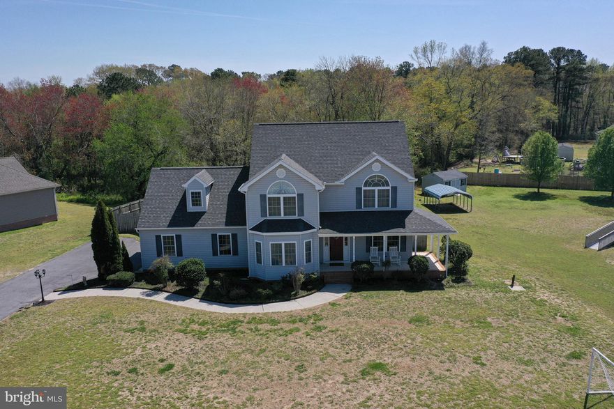 Immaculate, tastefully-upgraded contemporary colonial in desirable Mockingbird community, established neighborhood of quiet, no-through streets, & lovely homes. Welcoming curb appeal in this 3BR/2.5BA home w/ large bonus room – from the mature landscaping, covered front porch, and palladian windows adorning the gables. Expansive family room offers enough space for two separate sitting / entertaining areas – or a formal dining area. Dream kitchen is sure to charm even the most discriminating chef - features high-end Italian Bertazzoni appliances, quartz countertop & island w/breakfast bar, custom backsplash, tons of soft-close drawers and cabinetry. Handsome and durable LVP flooring throughout the first floor. Flex room offers so many possibilities – formal living, formal dining, office. A half bath completes the first floor. Upstairs, relaxing owner’s bedroom w/full, en-suite bath – double-sink vanity, jetted tub, step-in shower. Huge bonus room offers even more flex space – game room, theatre room, hobby or crafting room – whatever you choose!  3 additional bedrooms, each w/ceiling fans and roomy closets. 2nd full bath w/double-sink vanity, tub/shower combo. Second floor Laundry room w/Speed Queen commercial grade washer & dryer. Unfinished storage space with tons of room from all of your seasonal items. Outside you’ll find a huge fenced yard, nice size deck-perfect hang out spot on cool fall afternoons or grilling/smoking your favorite meats. Sellers have made so many improvements including fresh paint throughout, LVP flooring, HVAC, high end appliances & so much more!! This home has been lovingly cared for & has so much potential for a growing family for years to come. Just over two miles from the desirable Mardela Middle/High School, schedule your private tour as this one won't last long!