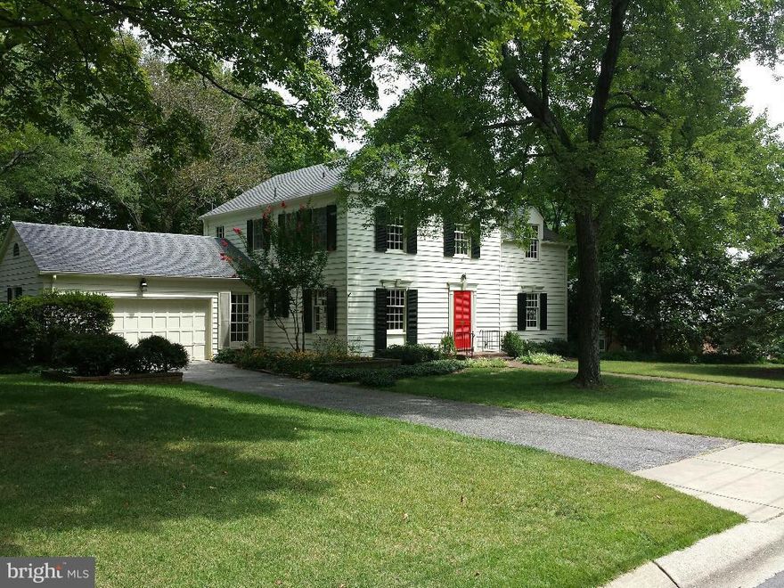 Gorgeous Colonial!  Main level features formal LR w/FP, sep DR w/access to sunroom, updated kit w/ss appls,corian counters, laundry area, garage and rear exits, den w/built ins and powder room. Upper level features MBR w/ensuite BA, 3 additional BRs, hall bath and attic access. Lower level recreation room w/ exit to rear, full bath, bar and utility room.  HWDs, patio, private lanscaped rear yard.