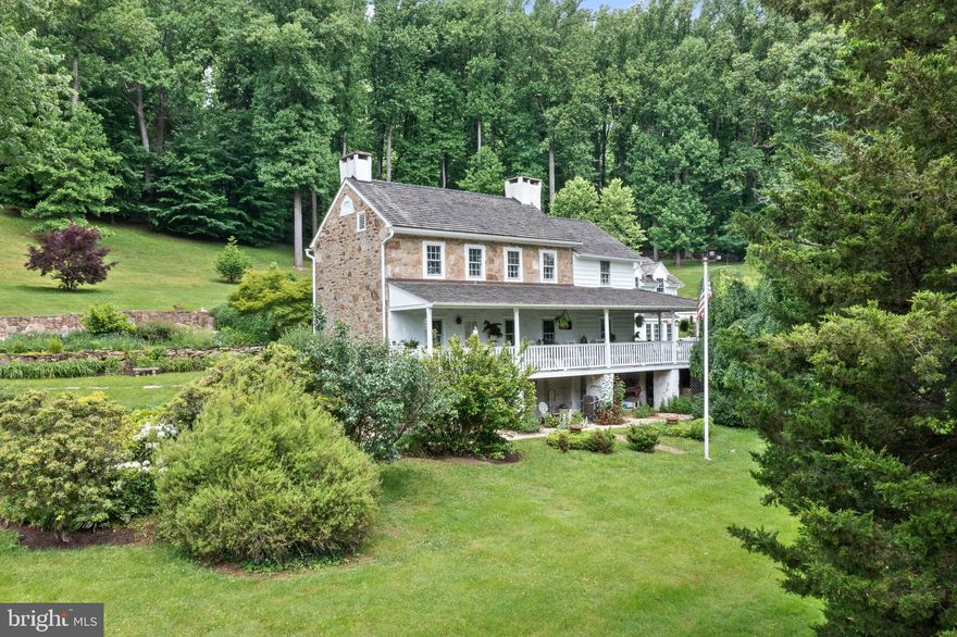 Hard Scrabble Farm is being offered for the first time on the market! The original owner was Carleton Davis, hence Davis Lane. A Stunning property on a quiet gravel lane in desirable Chester Springs. Located in walking distance to the charming village of Birchrunville.  The Circa 1821 Stone Farmhouse has a wrap around porch with incredible views of stone walls surrounding the property and the countryside. This property is surrounded by 250 acres of conserved land. Extensive Landscaping and Hardscaping, Springhouse, Wishing Well all add to the charm of this property. Enter the farmhouse through stone walkways and gardens. An entrance hall takes you to a formal living room with two fireplaces. A formal dining room perfect for family gatherings has a secret cabinet for storage. The gourmet kitchen with a family room and breakfast area is a focal point of the house, all with access to the wrap around porch. Walnut floors, Tiger Maple Island, custom built cabinets with milk paint and soapstone countertops are just a few of the special features of this farmhouse kitchen. The first floor is complete with a pantry, laundry room  and powder room. Walk out to the pool from the second floor hall. The primary bedroom suite has its own wing with access to a private balcony.  Perfect for morning coffee! The primary bath has the original soaking tub, a large tiled shower without a door and radiant heat floor. There are 3 additional bedrooms and a hall bath.  A large bank barn has an abundance of storage along with a small office with a separate entrance and 3 Car Garage with side access. For the equine enthusiast there is a two stall Amish built stable with center entrance and a side entrance with equipment storage area. The pool has a stone surround and has breathtaking views of the farm and countryside. An Amish built log cabin pool house with electric, wet bar and outside shower complete the pool area! Enjoy your own private retreat!! Property has a whole house generator! This property has a French and Pickering Creek Conservation Easement and is in Act 319. Close proximity to major routes, shopping and restaurants.