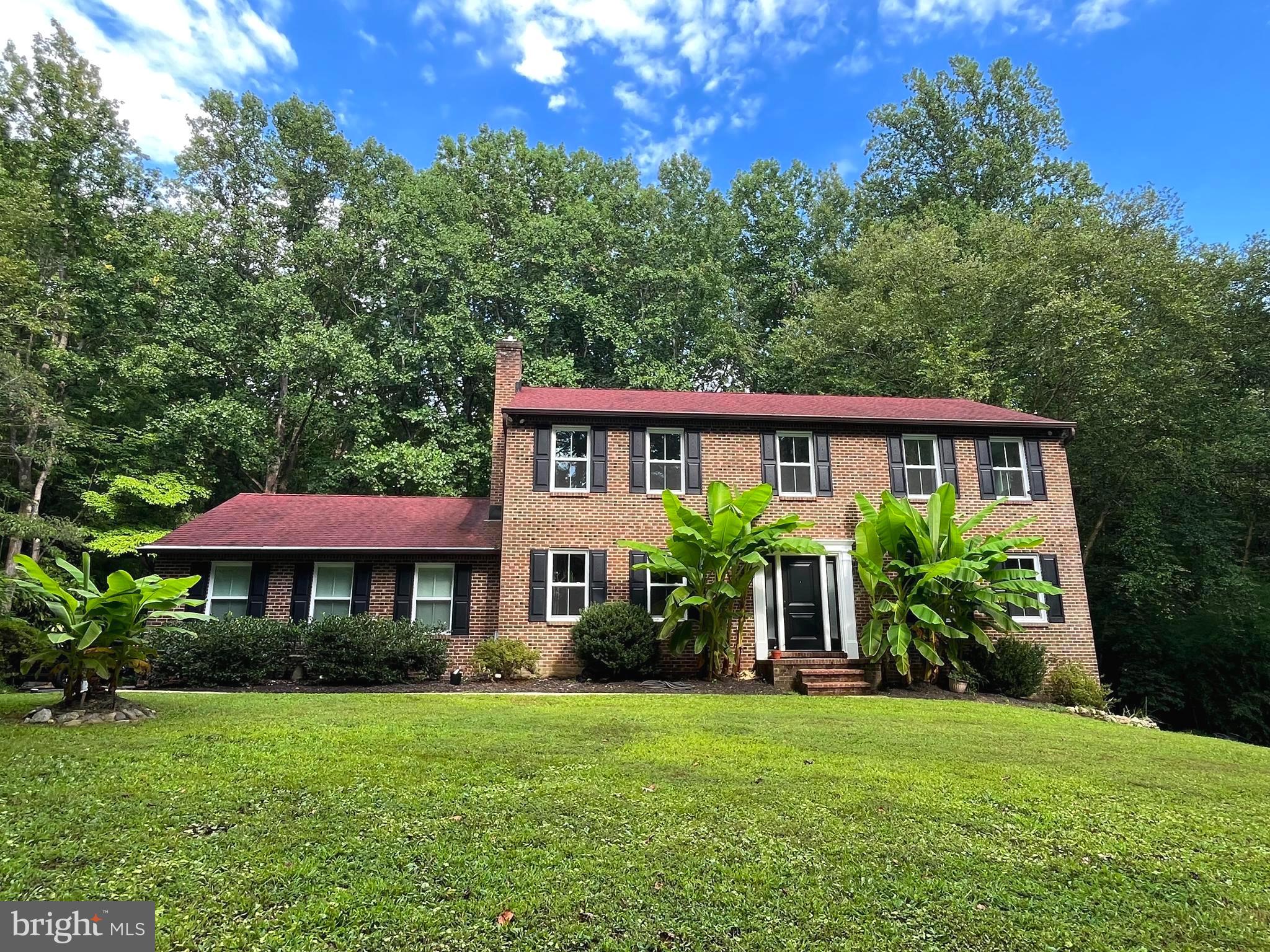 Private & Spacious! Tucked away on a quiet Owings cul-de-sac and backed by peaceful woods, this beautiful 5-bedroom, 3.5-bath brick colonial offers the perfect blend of privacy, space, and thoughtful updates. On the main level, you'll find a spacious layout with versatile rooms: a formal living room, dining room, laundry room, half bath, and a cozy family room featuring a wood pellet fireplace. The eat-in kitchen opens to a large screened-in porch with skylights and open deck, offering seamless indoor-outdoor flow and a great space to enjoy your private backyard setting.
Upstairs features three generously sized bedrooms, a full hall bathroom, and a private primary suite complete with a walk-in closet, a large vanity with sink, and a full ensuite bath. One of the additional bedrooms includes a convenient second access from the primary - ideal for a nursery, office, or flex space.
The nearly finished walk-out basement offers a large rec room with TV and electric fireplace, full bathroom, bedroom, bonus room - perfect for a home office, gym, guest suite, or hobby space - and covered back patio.
New windows and doors were replaced in 2025 with energy-efficient, easy-clean models that enhance both style and performance. Major updates completed in 2018-19 include a new furnace, HVAC, well and septic system, and screened gutters providing long-term peace of mind.
Additional highlights include an attached 2-car garage with vaulted ceilings, custom shelving and workbenches, and NO HOA! Located close to Rt 4, Rt 2, shopping, restaurants, Joint Base Andrews, and Twin Beaches, this home offers the perfect combination of privacy, functionality, and locale. With spacious living, smart updates, and a serene wooded backdrop, this colonial is ready to welcome you home!