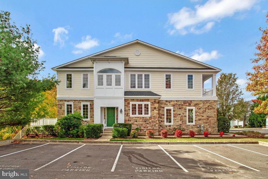 This 55+ end unit 2 car garage villa in super popular active adult Snowden Overlook Community is situated on a PREMIUM end of street lot backing to wooded open space.  Greet visitors at your grand, covered side entrance (where generous guest parking is available); the comfortable main level includes a two story, light filled living room with handsome stone accented gas fireplace, dining area & adjoining kitchen; primary bedroom & ensuite bath; convenient laundry room; & half bath. Both the living room & primary bedroom have sliding glass doors (new in 2021) opening to the relaxing rear deck overlooking peaceful woods - ideal for a morning coffee or an evening beverage. The impressive upper level has a versatile & spacious loft, 2 bedrooms & a full bath (plus a separate heating/cooling zone). Take entertaining up a notch in the walkout lower level with a theatre room & stunning custom bar area! This level also includes a full bath & storage areas. Your easy living lifestyle will flourish here - gather with neighbors in the tremendous clubhouse           (staffed full-time), pool (complete with a kiddie pool, life guards and lounge chairs, gym),  gathering spaces & ultra convenient location near shopping, restaurants, downtown Columbia amenities , parks, walking trails, and cultural activities. The entrance gate and guard house are manned from 8 PM to 5 AM daily.("Other Fee" of $1740.73 is the annual Columbia Association fee)