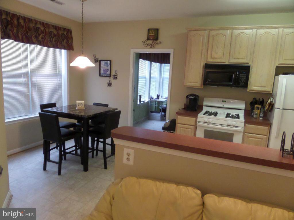 TURN KEY & GO. GENTLY LIVED IN 1ST FLR W/OVER 10K OF IMPROVEMENTS & UPDATES IN PAST 2 YRS. UPDATES INCLUDE-HVAC SYSTEM 6/15. FRIG W/ICE MAKER & STOVE 8/14. CARPET, PAINT & KIT FLR 8/14. EAT IN KIT W/3RD BEDRM/FAM FM OFF KIT. SLIDER TO SCREEN PATIO. MSTR BEDRM W/PRIV BA & HUGE W-IN CLOSET. BEDRM 2 AT OPP END W/FULL BA W-IN CLOSET & W-IN SHOWER. FULL SZ WASHER & DRYER. CLUBHSE W/POOL & FITNESS RM.
