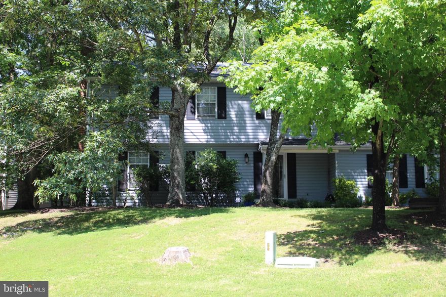 This traditional colonial single-family house is a gem...a corner lot property in a quiet, lovely neighborhood conveniently located near the MVA, St. Charles Mall, other shopping venues, schools, short distance to DC, Andrews AFB, and beltway. Come see this lovely 4BR, 2.5BTH featuring a deck for hosting cook-outs or relaxing in the shade, spacious 2-car garage, new wall-to-wall carpet throughout the entire house, upgraded bathrooms, separate dining room, eat-in kitchen, family room w/fireplace, and formal living room.
