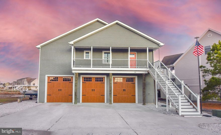 Experience waterfront living at its finest in this well maintained 4-bd, 2.5 ba home. The open-concept design features vaulted ceilings, quartz countertops, a gourmet 6-burner gas stove & engineered hardwood floors throughout the living spaces and bedrooms. Enjoy a spacious kitchen with a large walk-in pantry. The primary suite offers a walk-in closet & double bowl sink, while barn doors add rustic charm throughout. Insta-shade blinds provide instant privacy at the touch of a button. Entertain with a dining table that converts to a slate pool table, relax on the furnished deck, or take the included skiff out on the water. With an elevator and Murphy bed for flexible space, this home blends comfort, style and convenience. This home’s great attributes continue on with the whole house generator, over-sized breaker panel for 200 AMP service with sub-panel in the garage, a brand-new hot water heater and a manifold plumbing system which allows all plumbing fixtures to be turned off individually from the garage mechanical room. There are also hose bibs on each main floor deck.  Just another small but ease-of-living feature found throughout this home. For your convenience all doors (with exception of entry doors) are either barn door or pocket doors - eliminating the door swing problem often encountered in floor space issues. The garage floor and portion of the driveway (full concrete) is supported by its own underground piling system. The garage is double deep and can accommodate up to 6 cars (over 1,700 sq ft) with additional storage adjacent to the garage space. The garage also includes over 200 feet of built-in shelving as well as fishing rod storage. Additional storage is offered in the enclosed area under rear staircase. After a nice day on the water or at one of the local beaches the outdoor shower with hot and cold-water hose bibs will help you keep the sand outside. The outdoor amenities don’t stop there. Did I mention the 10,000 lb 4-post boat life and fish cleaning station? When the cold weather comes the hose bib at the dock edge has capability to drain and blow-out for winterization. The pellet stove can be set to run on a thermostat mode or manual mode and can heat the entire house (output to 50,000 btu). This is the home you have been waiting for in the resort community of Captain’s Cove. Schedule your showing today!