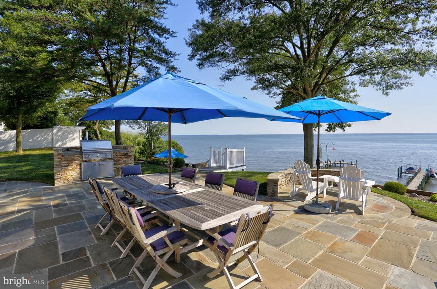 Welcome to 8171 Bayside Drive in Pasadena — a waterfront retreat offering the perfect blend of luxury, comfort, and coastal living. Situated on a 1/2 + acre flat lot, this 3-bedroom, 3-bath home features a sunlit-filled great room with panoramic bay views, a formal dining room, breakfast room and a gourmet kitchen, with 42" cabinets, and stainless-steel appliances.

Enjoy outdoor living at its finest with a multi-level deck, rear stone patio, built-in grill, and firepit on the beach — perfect for relaxing or entertaining. Stroll down the stairs to your private beach or take advantage of the 125-ft L-shaped pier featuring a boat lift and jet ski lift. A detached garage with storage above, shed with electric, and voluntary HOA ($65/year) add to the appeal.  NEW BAT septic system (tank, field and pipes) being installed meeting all of the requirements of the Chesapeake Bay Critical Area. Well recently passed yield test inspection and water quality testing (sept. 2025)

This is waterfront living at its best — perfect for those seeking both serenity and adventure.