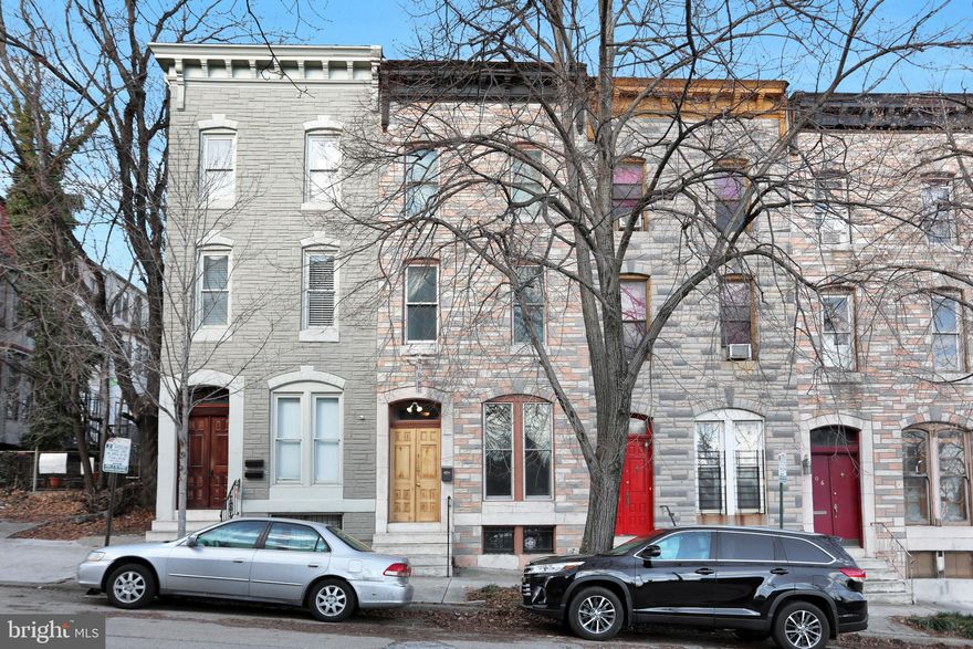 Charm, location, size - what more could you ask? Baltimore charmer complete with pocket doors leading into living room & dining room; beautiful hardwood floors throughout, fireplaces have been capped but add the ambiance you're looking for. Replaced windows, central air, half bath on main level, huge kitchen with Jenn Air cooktop & modern butler's pantry. 2nd level's primary bedroom is currently being used as the family room so door can be installed back on.  Laundry & full bath, complete with jetted tub are off this room. 2nd bedroom is also on this floor. 3rd level is lit up by the skylight & takes you to the other 2 bedrooms and full bath. Seller rents space for parking behind the house. This home is in walking distance to everything - Penn Station, University of Baltimore, MICA, Sunday's best Farmer's Market under 83, the Flower Mart in the Spring , Artscape in the Summer, Walters Art Museum & many fine restaurants & shops.