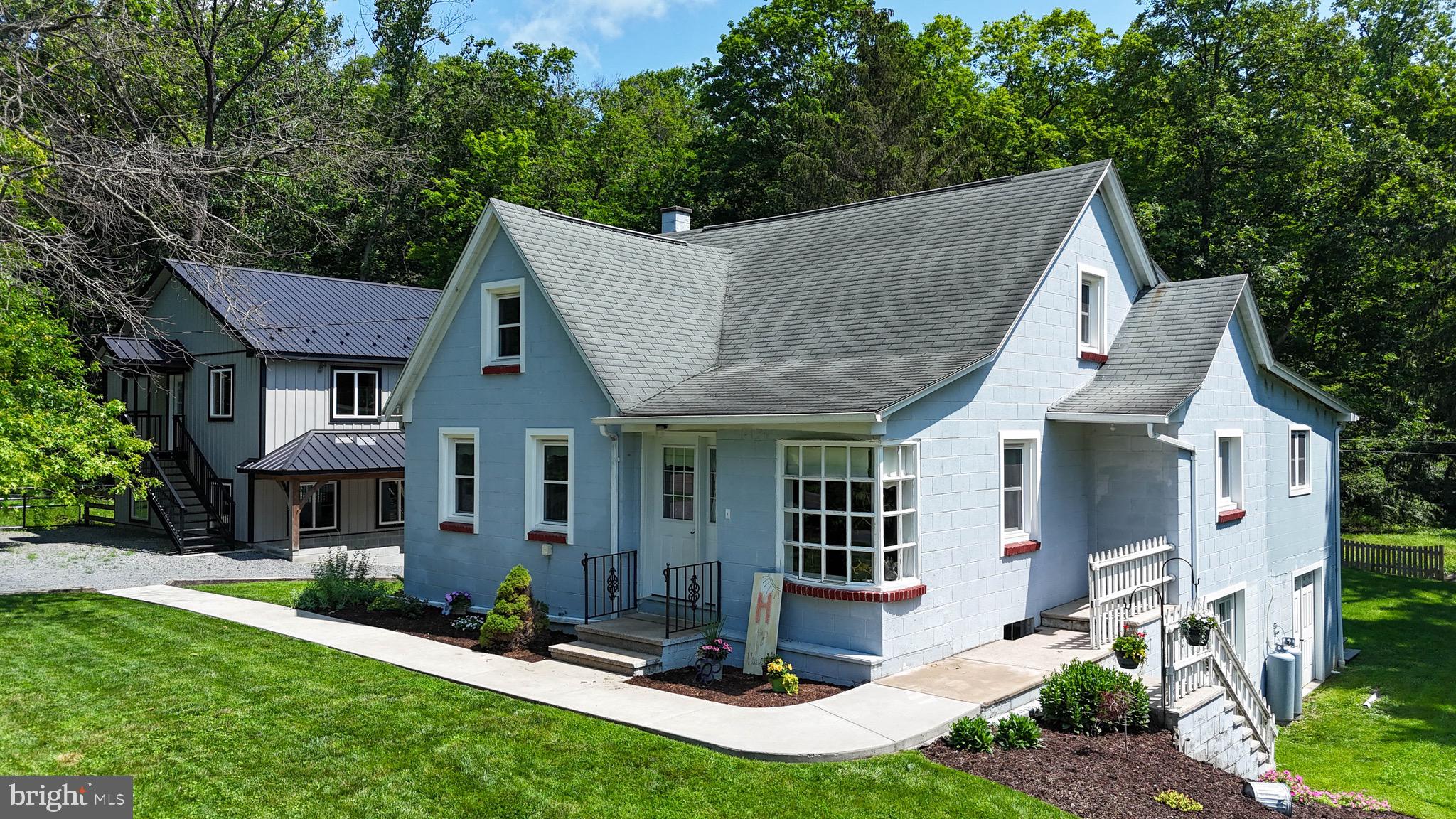 **This property will be offered at Public Auction on September 16, 2025 @ 6:00 PM. The listing price is the opening bid only and in no way reflects the final sales price. $45,000 Deposit due on auction date. 2% transfer tax to be paid by the purchaser. Settlement on or before November 28, 2025.**Discover your dream countryside escape at 231 Swamp Road, Morgantown—where rustic charm meets modern comfort on 7.1 scenic acres. This beautifully remodeled 4-bedroom, 2-bath home offers a welcoming interior with open stairway, den/office with fireplace, and radiant heat throughout. Enjoy peaceful evenings on the backyard deck overlooking a stream, with a walking bridge that connects you to wooded trails, a campfire area, and prime hunting grounds. The property includes a newly constructed 30' x 48' horse barn with three stalls, 18' x 22' workshop, and a second-story rec room perfect for group gatherings. With vegetable gardens, a large backyard, and the West Branch of the Conestoga River flowing through, this is a rare opportunity for homesteaders, hobby farmers, or nature lovers.