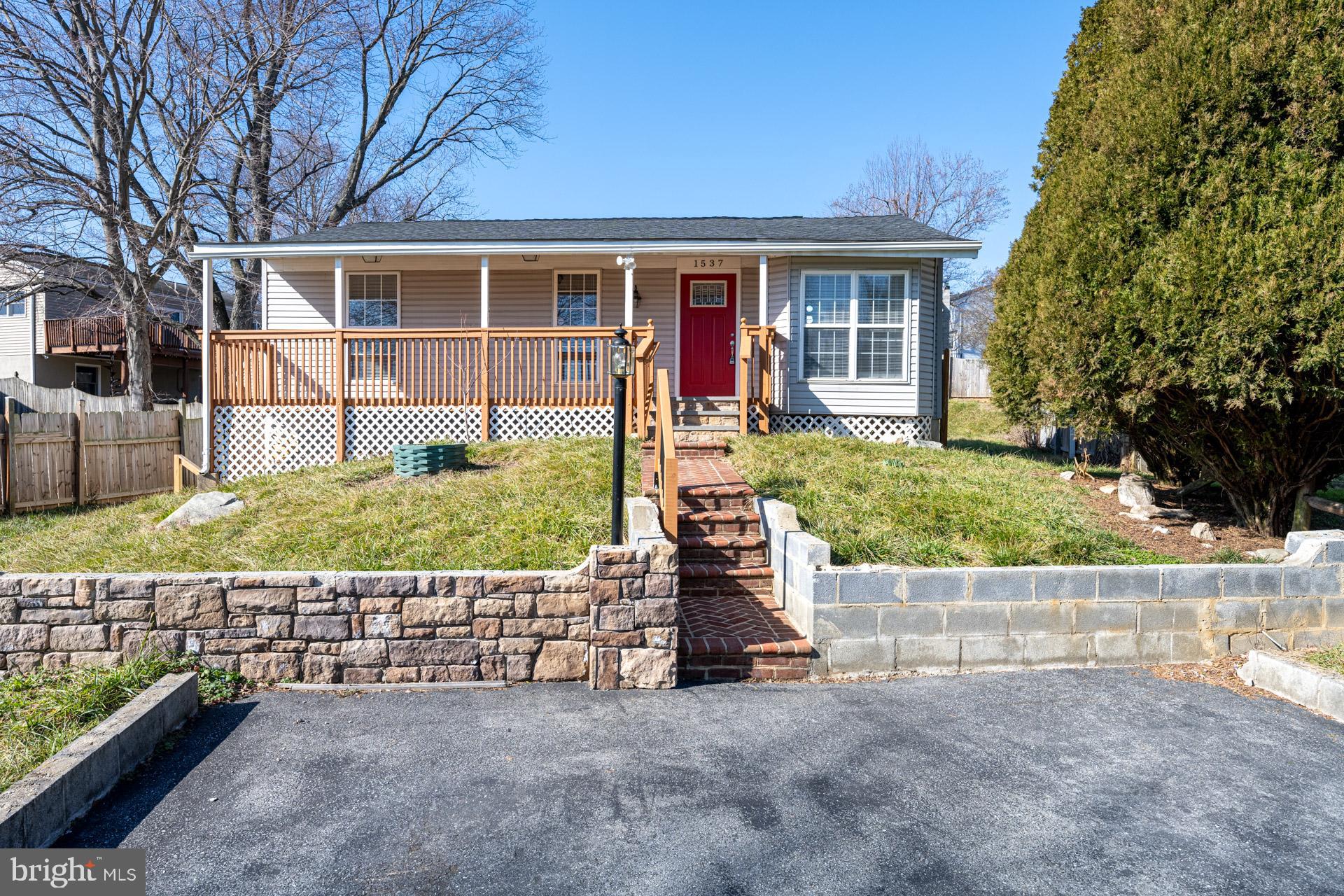 Welcome to this beautifully renovated rambler in the Stonegate Farms community—offering the freedom of no HOA! This 4-bedroom, 2-bath home blends comfort and style with thoughtful updates throughout. Enjoy the charm of the large front porch before stepping inside to an open-concept living and dining area, seamlessly connected to the updated kitchen featuring white cabinetry, quartz countertops, a subway tile backsplash, and stainless steel appliances. A spacious rear family room provides additional living space and opens to the semi-fenced backyard—perfect for entertaining or relaxing. Three generously sized bedrooms and a full hall bath are located on the main level. The fully finished basement expands your living options with a fourth bedroom, second full bath, bonus room, and a laundry area. A fantastic opportunity in a peaceful, established neighborhood!