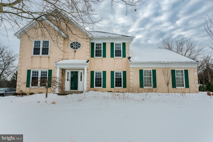 PICTURE PERFECT! Welcome home to this immaculate and meticulously maintained 4-bedroom, 2.5-bath Belmont model in the desirable Meadow Wood neighborhood and the award-winning Pennsbury School District. Ideally located on a premier lot, this traditional home has wonderful flow and expansive spaces for gathering. This exceptional home is in pristine condition and sparkles throughout. Step into the grand two-story center hall, immediately impressing with abundant natural light, soaring nine-foot ceilings, and gleaming hardwood floors that span most of the first floor. To the right, a private first-floor study is appointed with double glass French doors and oversized windows. Opposite, the spacious living room flows seamlessly into the dining room, enhanced with classic crown molding defining each space. The dining room is finished with a beautiful bay window providing abundant natural light. You will love the chef-inspired gourmet kitchen, boasting 42-inch maple cabinets, Corian countertops, stainless steel appliances, double ovens, and a center island with a gas cooktop and a large pantry. Savor your morning coffee in the breakfast room with french doors leading to the serene sunroom with a Palladian window, cathedral ceiling, and panoramic views of the lush manicured backyard with easy access to the Trex deck with a retractable awning and steps leading to a paver patio and shed. The backyard offers privacy, beauty, and a peaceful retreat. Just off the kitchen, step down into the great room highlighted by vaulted ceilings, a charming window alcove with plantation shutters, multiple skylights, and a dramatic floor-to-ceiling stone gas fireplace - creating an inviting space for both everyday living and entertaining. The main-level laundry room features a utility sink, built-in cabinets, and direct access to the oversized two-car garage with Craftsman insulated doors. Upstairs, the primary suite is an exquisite retreat offering a tray ceiling and a large walk-in closet. Enjoy the en suite bath featuring a soaking tub, separate shower, and double vanity. Three additional nicely sized bedrooms and a hall bath with a combination tub and shower finish the second floor. A full basement with nine-foot ceilings completes this beautiful home. The home is bolstered by high-value updates, including a newer roof with 50-year shingles, newer high-efficiency windows, and a newer high-efficiency Carrier Infinity HVAC system with Wifi compatibility. Additional enhancements include a resurfaced driveway, blown-in attic insulation, a newer Anderson sliding sunroom door, and a newer suite of stainless steel kitchen appliances. A full basement with nine-foot ceilings and Drylock insulated walls completes this beautiful home. Conveniently located within walking distance to shopping, Five Mile Woods nature preserve and close proximity to major roadways. Enjoy easy access to I-95, Philadelphia, Princeton, and NYC, while experiencing the charm of historic Bucks County living. The home is conveniently located near the new shopping, and recreational opportunities in nearby Yardley, Newtown, and the surrounding communities. This home is move-in-ready and has been lovingly maintained!