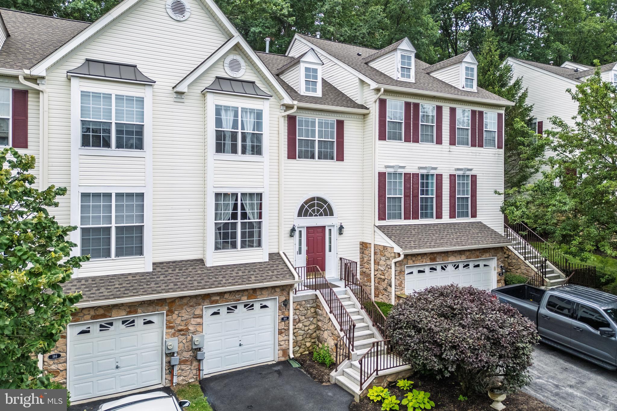 Enjoy resort-style living with an easy stroll to the community pool, tennis courts, and clubhouse in Whiteland Woods! 188 Fringetree Dr is an immaculate 3 bedroom, 2.5 bath townhome that offers a low-maintenance lifestyle and an impressive home design all in one. The impressive floorplan features front living and dining room, 1st floor powder room, and a stunning open-concept kitchen and family room. With newer hardwood flooring and recessed lighting, and walls of windows, this floorplan is bright and welcoming from the front entrance straight through to the newly painted back deck which overlooks a lush, wooded backdrop. Enjoy beautiful morning and early afternoon light throughout the back of the home, and in the late afternoon and evening you can enjoy the shaded back deck while the front living room is bathed in light. A great home for indoor/outdoor gatherings, the kitchen features a large center island, granite countertops, gas cooking, and stainless steel appliances – a chic and stylish space to entertain. Upstairs, there are 3 bedrooms and 2 full bathrooms including a spacious owner’s retreat with a walk-in closet and en suite bathroom. There’s also a finished basement with newer carpeting – a great space to set up a home office, workout room, game room, or more. Plus, this home also offers an attached 1-car garage plus private driveway parking. Situated in a truly convenient location, you’ll be minutes from the shops at Main Street at Exton, and you’ll also be minutes from local commuter routes as well as SEPTA and Amtrak service. Whiteland Woods offers a low-maintenance lifestyle which includes landscaping, snow removal and roof replacement. And on top of all that, 188 Fringetree Dr is located just a few buildings away from the Whiteland Woods community clubhouse and pool, so you can enjoy the community amenities with a quick easy stroll. It’s the best of all worlds – a vibrant resort lifestyle, versatile floorplan and convenient location. Request a personal tour today!