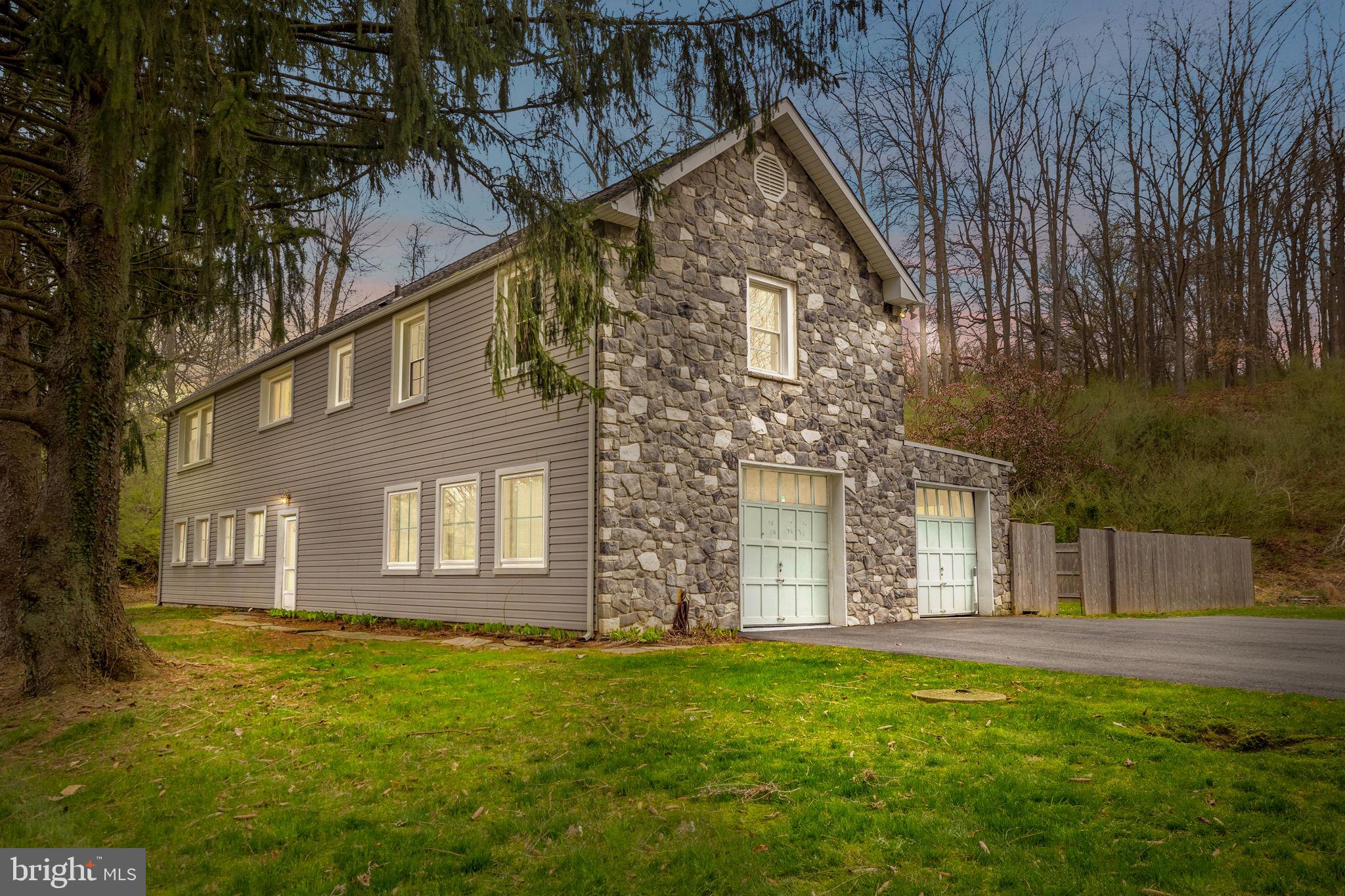 Incredible Opportunity in the heart of Chadds Ford, highly sought after Unionville school district, 10 minutes to West Chester and Wilmington.  This 3+ acre property is surrounded by luxury homes and features exterior stone and vinyl siding with RM2 zoning (1 acre lots, may be able to be subdivided).  The first floor includes a 4 car heated garage with fresh epoxy floors and a powder room, perfect for the car enthusiast.  There is also a large room with recessed lights, a full bathroom, closet  and private entrance.  This makes for a great home office, additional bedroom, business space or rental opportunity to house hack.  Add a kitchenette off the full bathroom for a full in-law suite / separate apartment.  There are also two other garages on the first floor for additional storage.
The main entrance is at the back of the home, through a private fenced in entrance to the foyer with new flooring and paint.  Up the stairs you’ll find a huge living room, new lighting, updated large eat-in kitchen, hardwood and LVP floors, two bedrooms with new ceiling fans, a renovated bathroom and laundry room.  Fresh paint throughout, all you have to do is move right in!
Chadds Ford Zoning permitted uses includes: professional office for an IT professional, doctor, dentist, teacher, artist, architect, musician, designer, lawyer or similar business.  You will not find a better investment opportunity in the Unionville-Chadds Ford school district!  This property has very low taxes for the area at $4300 and is located close to great shopping and restaurants in Wilmington and West Chester, this home truly offers an amazing opportunity for the savvy home owner or real estate investor.