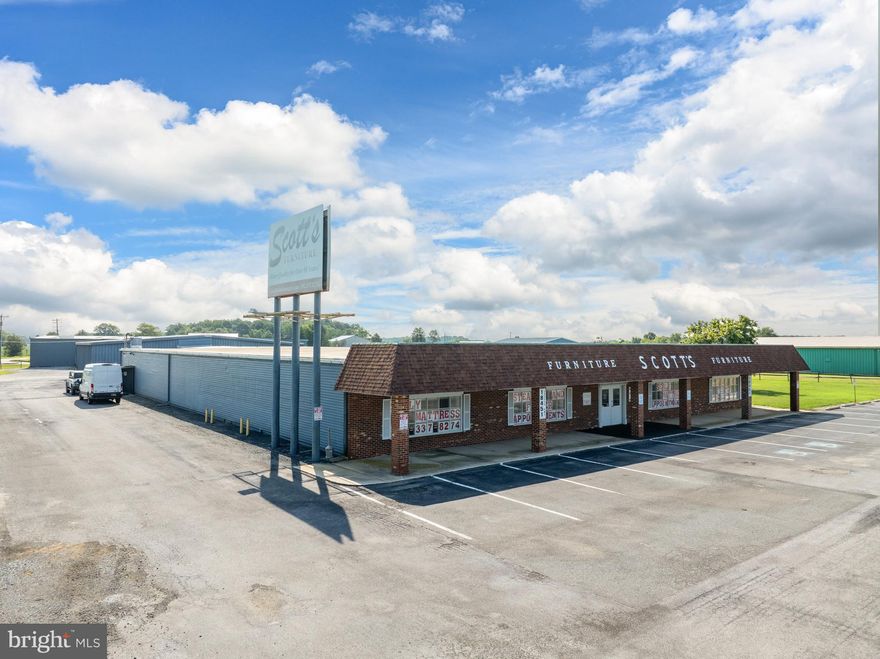 This site ingress/egress from 2 entrances off Sussex Highway as well as 2 entrances off of Rifle Range Road.  The corner location provides good accessibility.  Good visibility is provided as a result of the heavy volume of vehicular traffic along Sussex Highway.    This parcel is improved with a 21,900 SF,  allocated as 19,000 to showroom and 2,960 SF to warehouse.  There is 13,000 SF of open furniture showroom, 5,600 SF of recliner showroom, 400 SF passageway and 2,960 SF metal warehouse with overhead door.
This property is a great location, this has been a successful furniture store for many decades.