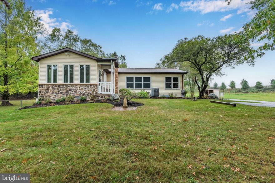 Welcome to your dream retreat! This well-maintained 3-bedroom, 2.5-bath ranch is nestled on nearly 6 acres of picturesque land, featuring a tranquil stream and stunning custom stone bridge. As you enter, you’ll be greeted by a spacious open floor plan, with fresh paint and new carpet, that highlights the multiple options for living spaces. The Kitchen features rich cherry cabinets and is the perfect space for the culinary enthusiast. A relaxing Sunroom with vaulted ceiling and ceramic tiled floor, overlooking the grounds, is perfect for relaxing or reading a good book. The generously-sized Primary Suite boasts a spacious walk-in closet and private bath. Two additional bedrooms and hall bath ensure ample space for family and guests. The finished walk-out lower level provides additional living space and endless possibilities for entertainment or relaxation. Outside, you’ll find an oversized, 3-car detached garage, a small 3-stall horse barn, both with electricity, and shed for extra storage. Enjoy peaceful afternoons in the charming gazebo, surrounded by nature and all its wonders. Conveniently located between Harrisburg and York, this property is perfect for those seeking a serene lifestyle, while being close local amenities and area highways. Don’t miss this chance to make this unique property your own – Schedule a showing today!