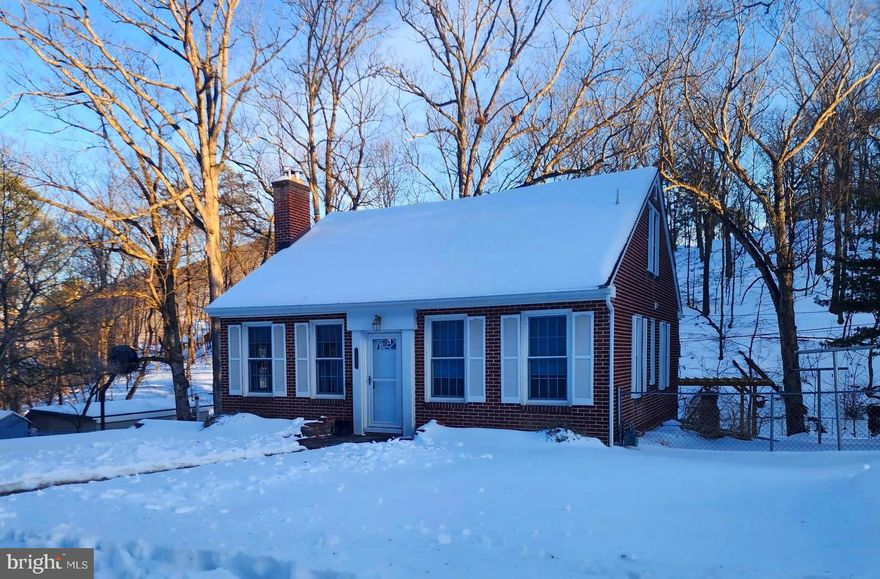 Charming brick home full of updates!
This 3-bedroom, 2-full-bath home has been beautifully transformed over the past five years. Updates include a new kitchen and baths, HVAC system, driveway, refinished hardwood floors, rear screened porch, and all new appliances. A new roof was installed in 2019.  The main level features a bedroom and full bath, along with a cozy fireplace. Situated outside the city in a rural neighborhood, the home offers public utilities, a large serene yard, a fenced area, and a seasonal stream at the rear of the property.  Conveniently located near all the outdoor adventures Mountain Side, Maryland has to offer.
Schedule your tour today!