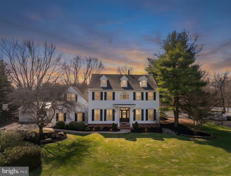 Open House Saturday March 28th 11-2pm…Welcome to 110 Mallard Drive West, where classic elegance meets inspired, modern living! Set on over a half acre on one of the most desirable lots in the neighborhood, this stately white Colonial has been beautifully updated with a light, airy aesthetic. With over 4,000 square feet, this 4-bedroom, 2 full and 2 half bath home offers space, style, and an easy, inviting flow for everyday enjoyment and entertaining.  A stunning 2-story Foyer opens to sun-filled interiors, highlighted by wide-plank French white oak hardwood floors and thoughtful finishes throughout. The Dining Room stands out with a custom brick accent wall and French doors, creating a warm, welcoming space for gathering. The Family Room features custom moldings and a wood-burning fireplace and opens seamlessly to the spacious Kitchen, complete with granite countertops, updated cabinetry, stainless steel appliances, dual pantries, and a bright and sunny bay window overlooking the backyard. A lovely Living Room (currently playroom), spacious Mud-Room, Laundry and Powder Room complete the main floor. Upstairs, the Primary Suite delivers a true retreat, featuring a vaulted ceiling, gas fireplace with custom finishes and built-ins, exposed beam detail, 2 walk-in closets, and a spa-like bath with soaking tub and glass-enclosed shower. 3 additional bedrooms and an updated hall bath complete the second level. The fully finished lower level offers flexible spaces for whatever you need- movie nights, play space, home office, or entertaining with a wet bar, and features a powder room and plenty of storage. Outside, the setting feels like your very own resort! Backing to pond views, the scenic backyard offers a true escape with a sparkling in-ground salt water pool, expansive patio, bocce court, and multiple areas to lounge, dine, and unwind- perfect for summer days and evenings with friends. Additional highlights include a 2-car attached garage and a 1-car detached garage with storage, along with extensive updates throughout including: new flooring (2019), light fixtures (2019), paint, appliances, HVAC Unit (2021), front & back doors, and repaved driveway (2022), making this home move-in ready!! Ideally located in the North Penn School District with easy access to major routes, shopping, and dining, this gorgeous classic is a must see…Welcome Home! ** Open House Saturday, March 28th 11-2 PM **