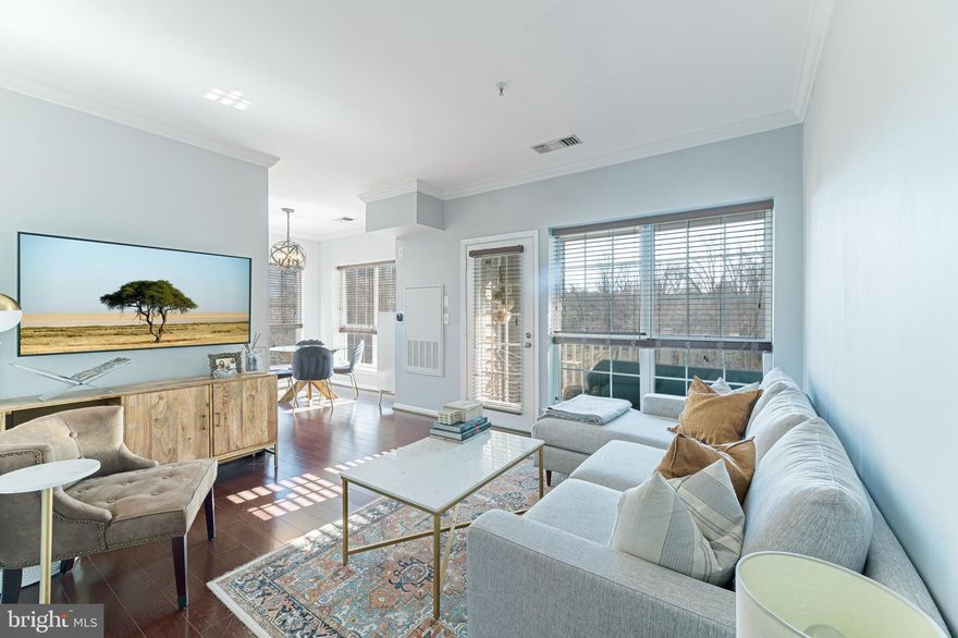 Amazing community in an incredible location and unique design that will make you feel like you are living on vacation year round!!!Gorgeous, sundrenched condo with gleaming hardwood floors throughout the living areas. Foyer entry greets you. Over-sized windows and a large balcony off of the living room. There is a second balcony off of the second bedroom. Charming eating area in a corner of windows. Stunning, luxury bath with gorgeous tiles, stylish vanity and sink and oversized glass shower. All of this overlooks trees, nature and a large pond! Assigned, garage parking space conveys. Beautiful community pool just down the corridor. Alexandria bus at the street for easy communitng. Easy commute to the Pentagon!