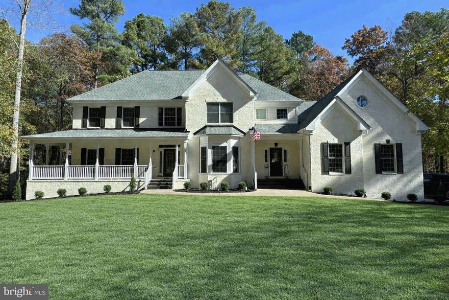 INCREDIBLE PRICE FOR THE EXQUISIT HONOR BRIDGE FARM SECTION OF FAWN LAKE! APPROXIMATELY 4 ACRES FORESTRY MULCHED NOV 2025 FOR MAXIMUM USE, KITCHEN REFRESHED WITH NEW QUARTZ COUNTERTOPS.

Spectacular custom brick French Manor Farmhouse style home situated on approximately 4.5 wooded acres in the highly desirable Honor Bridge Farm Estates section of the prestigious 2,350-acre Fawn Lake Community featuring a 288-acre lake with over 7 miles of shoreline and a deep water marina, wildlife sanctuary, fitness center, an Olympic-sized swimming pool overlooking the beautiful lake, walking trails, and an Arnold Palmer designed golf course with a private country club, golf pro shop, and driving range. The Fawn Lake community has many groups, clubs, and leagues for any type of enthusiast. Enjoy a casual meal with family and friends at the Lakeside Grille or an upscaled dinner at the Harbor Club.

Are you looking for ultimate privacy in an amenity-packed gated golf and lake community? Well look no further than this beautiful dream home under a canopy of trees with an extended driveway. Adorned by newly installed river stone hardscape complete with new landscape lighting all around. The driveway is flanked by brand new stone walls with new lighting, and all road facing stone fence pillars have new stone as well. The main and upper levels have oak hardwood flooring throughout. The entire interior and exterior were painted in 2022-2023.

A grand two story Foyer is flanked by a gracious Formal Dining Room and a Private Lounge with two sets of French Doors. The spacious Family Room with floor to ceiling windows and propane fireplace opens to the Gourmet Kitchen featuring granite counters, stainless steel appliances, and a marble tile backsplash. A Main floor Bedroom with large closet (currently used as an office) and adjoining Full Bath, plus a quaint side porch entrance leading to a Mud Room, complete the main level.

The grand oak staircase and additional back staircase lead to the upstairs with an incredible Owners Suite with large double walk-in closets and a fabulous newly remodeled luxury Spa Bath featuring a large jetted tub, heated tile floors, glass and tile shower, dual vanities, and heated towel rack. A spacious Bedroom with adjoining Full Bath and large walk-in closet, two additional Bedrooms with large walk-in closets share a Full Bath with dual vanities. An enormous Bonus 5th Bedroom offers unlimited living options. A spacious Laundry Room with ample cabinetry complete the upper level.

Designed for entertaining, the bright and open walk-out lower level features large windows and French Doors offers plenty of natural light. A huge Recreation /Family Room with a Full Custom Wet Bar /Kitchenette, Game Room, large Bedroom with shared Full Bath, and plenty of unfinished space for storage!

Immersed in privacy, the backyard features a large deck that blends seamlessly with the lush lawn watered by a 12-zone irrigation system and gorgeous landscape design, creating an ideal environment for outdoor dining, resting, relaxing, and entertaining.  Includes a whole house Generac generator. This home truly provides the perfect harmony of tranquil indoor and outdoor living. Complete with a large 4-Car Garage, Tesla EV charger, and extended parking lot driveway! New Roof in 2022! Property is being sold as-is with no known defects.

The beautiful gated Fawn Lake Community offers amazing amenities such as a boating recreational lake, beach, golf course, tennis courts, soccer & ball fields, dog park, volley ball courts, walking trails, Club House, marina, fitness center, restaurants, Country Club, playgrounds & so much more! Located on the countryside near protected park lands and only a few miles to the farm market, wineries & award wining breweries!

NOTES: *Ext Paint: dark brown accents are painted to match off-white, dark brown shutters added to front windows; *River Rock replaced with mulch and shrubs; *Quartz Countertops installed 2025.