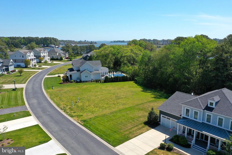 Build your dream home on this 0.35-acre interior homesite located in a sought-after gated, amenity-rich community. This lot offers a refined residential setting with a peaceful rear outlook toward Ayers Creek, creating a serene backdrop for everyday living. Public water and sewer are available for added convenience.
Residents enjoy access to a wide array of resort-style amenities, including tennis and pickleball courts, a clubhouse, fitness center, swimming pools, marina facilities, and optional golf course memberships. Whether you're seeking a full-time residence or a weekend retreat, this homesite offers the perfect blend of tranquility and community lifestyle in a prime location.