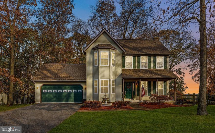 Welcome home to this beautifully updated colonial, offering timeless charm, modern finishes, and inviting spaces throughout. Enjoy your morning coffee or evening sunsets from the covered front porch, the perfect spot to unwind. As you enter, you’re greeted by LVP flooring flowing through the formal living and dining rooms. Entertain guests in the bright formal living room, ideal for gatherings or curling up with a good book. The dining room, located just off the kitchen, provides the perfect setting to wine and dine guests in style. The spacious eat-in kitchen is a true showstopper, featuring upgraded countertops, stainless steel appliances, tile backsplash, abundant cabinetry, and a large island offering even more prep and storage space. A pantry ensures plenty of room for all your kitchen essentials. Off the kitchen, the family room offers a warm and welcoming retreat with hardwood floors, chair railing, coffered walls, and a cozy fireplace. A powder room completes the main level. Upstairs, the spacious primary suite feels like a true retreat with vaulted ceilings, wood beams, and a custom accent wall. The walk-in closet provides ample storage, and the recently renovated ensuite bathroom features dual vanities, a large walk-in shower, and a luxurious stand-alone soaking tub. Three additional bedrooms and a full hall bath with a tub/shower combo complete the upper level. The fully finished lower level offers a large rec room, perfect for a home theater, playroom, gym, or additional gathering space. Step outside to the large fenced-in backyard, ideal for outdoor entertaining, summer BBQs, or evenings relaxing under the new gazebo. Parking is effortless with an attached 2-car garage and a long driveway for additional vehicles. Conveniently located near Route 30, Route 27, and close to shops, restaurants, and local conveniences, this home combines comfort, style, and unbeatable location. Don’t miss your chance to make this beautifully updated colonial your next home, schedule your private tour today!