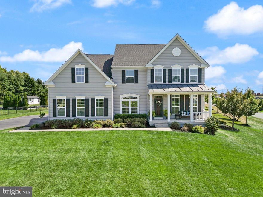 HUGE Price Improvement!!  Welcome to this beautiful Nokesville home, perfectly situated on over an acre of land and connected to public sewer. Truly a rare find in the area! With 4 spacious bedrooms and 3.5 baths, this property blends elegant design with the charm of country living. Step inside to discover a bright, open floor plan designed for both comfort and entertaining. The main level features a sought-after primary suite with a luxurious ensuite bath and large walk-in closet. The heart of the home is the gourmet kitchen, complete with double ovens, upgraded countertops, stainless steel appliances, and an oversized island-perfect for gatherings and home-cooked meals. The kitchen flows seamlessly into the spacious morning room, where large windows fill the space with natural light and provide beautiful views of the backyard. Adjacent to the kitchen, the open family room offers a warm and inviting atmosphere, featuring a cozy fireplace and plenty of room for relaxing or entertaining guests. Upstairs, you’ll find three additional bedrooms and a full bath, offering privacy and space for family or guests. The finished basement expands your living area with a large recreation room and a dedicated theater room-ideal for movie nights, game days, or a home gym.  Enjoy outdoor living at its finest with a charming front porch and a rear patio overlooking the expansive yard. The 3-car garage provides ample space for parking and storage.

Located in the heart of Nokesville, this home offers the best of both worlds: a serene rural setting with the convenience of nearby schools, shops, and commuter routes. Nokesville is known for its strong sense of community, top-rated schools, and spacious properties, making it one of Northern Virginia’s most desirable areas to call home.

This property truly combines comfort, style, and the tranquility of country living-a rare opportunity you won’t want to miss!