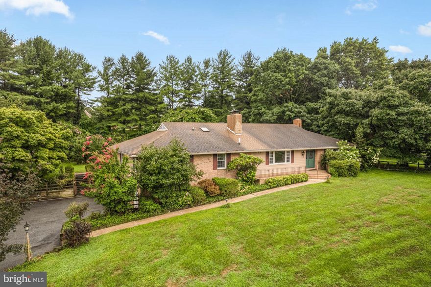 Perched majestically on a hill, 7 Amy Brent Way in Reisterstown, MD, presents a stately setting with a long, elegant curved driveway leading to this well-maintained Rancher/Rambler. Spanning over 3,500 square feet, the home features four bedrooms and 3.5 bathrooms, thoughtfully designed with a spacious Living Room, Family Room, Dining Room, and  Kitchen with newly updated LVP flooring, a cozy Breakfast Room, and a convenient Laundry Room with a Half Bath adjacent to the kitchen. Parquet wood floors are dotted throughout the home, adding warmth and character to its interior. Three inviting wood-burning fireplaces, skylights, and charming bay windows further enhance its appeal. The expansive  Primary Suite offers an en-suite bath with Skylight  and a 16 by 5 walk-in cedar closet,  two additional spacious bedrooms and a hallway full bath are also featured on this main level. The window lined Florida Room overlooks the meticulously landscaped, fenced rear yard, which includes an in-ground heated pool with a stone surround, a waterfall feature, and a pergola. The private yard also boasts fruit trees and wooded views, along with a play area and ample outdoor storage with a shed for pool equipment plus another secure 30 by 16 storage shed. The lower level features an expansive Rec Room with a wood stove, a Workshop, Game Room, Bedroom, and Full Bath, and could easily be converted into an in-law suite, with convenient access to the two-car garage and a walkout level. Additional amenities include a generator, a new hot water heater, a solar system, Ultraviolet odor and germ scrubbing system and a new HVAC unit. Ideally located with easy access to Interstate 795 and local amenities, this home combines luxury, functionality, and a prime location in a tranquil Reisterstown setting. Don't miss the opportunity to own this charming Rancher and all of its superb features...schedule your showing TODAY!