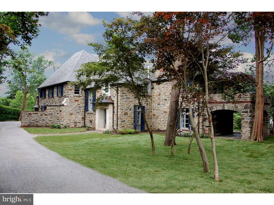 Recently completed masterful renovation of a stunning 1947, 5 Bedroom stone French Norman styled home.  Positioned on an idyllic one acre parcel on a beautiful tree-lined street, the home offers classic exterior architecture with a fresh, open floor plan highlighted by a neutrally selected interior palette.  Handsome stone floored Foyer offers sweeping iron stair and opens to a large Living Room with hardwood floors and marble surround fireplace.  Two sets of French doors lead to a blue stone covered side terrace.  A step down Dining Room is highlighted by soaring ceilings and an exit to full length rear terrace, with surrounding stone wall, ideal for expanded entertaining.   Chic all white Kitchen with honed black granite counters offers stainless appliances including a five burner gas cook top, double wall overs and crisp white subway tile backsplash.  A long center island offer-counter mounted sink and generous flat prep and storage space. Steps away find a Breakfast Area and through a wide, cased opening a large Family Room with wood burning fireplace and gleaming hardwood floors.  Brightened by two walls of windows this family space anchors the informal area of the home and provides an uninterrupted flow between the spaces.  Ascend the wide staircase to a generous Master Bedroom with his and her Master Baths with seamless shower and deep soaking tub.  Four additional family Bedrooms and 4 full Baths are accessed by a wide hall and connect to the back stairs leading to the fully outfitted Mudroom and Laundry Room and 3 car attached Garage.  Finished Lower Level with stone surround fireplace and built-in period bar provides additional recreation space and half Bath.  A well-conceived, beautifully executed renovation - pristine.